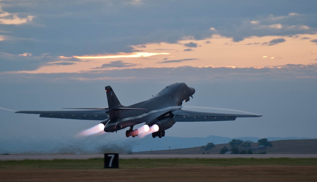 A B-1 bomber rumbles down the flightline at Ellsworth Air Force Base, S.D. , July 24, 2012 as part of a training mission. Each of the B-1’s four engines is capable of producing 30,000-plus pounds of thrust. (U.S. Air Force photo by Airman 1st Class Zachary Hada/Released)