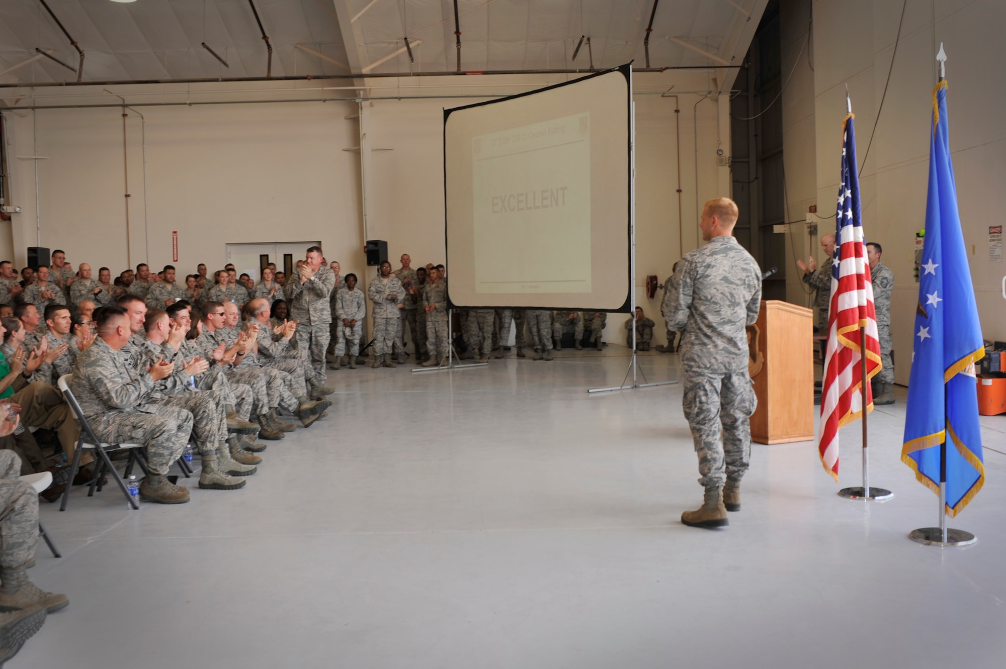 U.S. Air Force Maj. Steven Kohut, 27th Special Operations Wing Inspector General, announces the "Excellent" rating received for the 2012 Air Force Special Operations Command Consolidated Unit Inspection at an all-call near the flightline at Cannon Air Force Base, N.M., July 26, 2012. This year's CUI consisted of a combination of eight individual inspections and was the first of its kind for AFSOC. (U.S. Air Force photo/Airman 1st Class Ericka Engblom)   