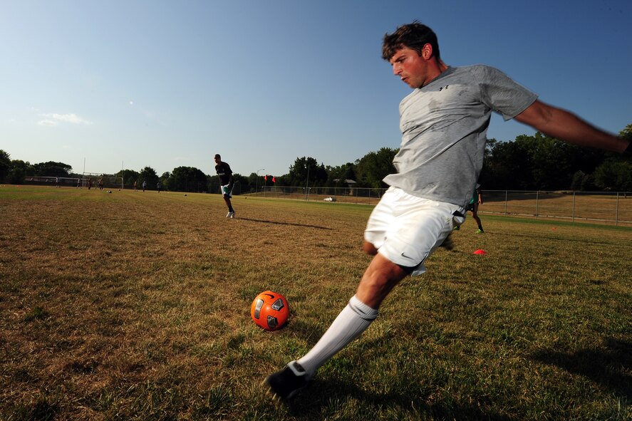 Jason Sellers, a midfielder for FC Offutt and a civilian with U.S. Strategic Command PMO, nails a free kick during a practice session July 24 at Bellevue East High School in Bellevue, Neb. FC Offutt is in its inaugural season and will head to Lackland Air Force Base, Texas, over Labor Day weekend to compete in the Defender’s Cup, an annual military soccer tournament. (Photo by Josh Plueger/Released)