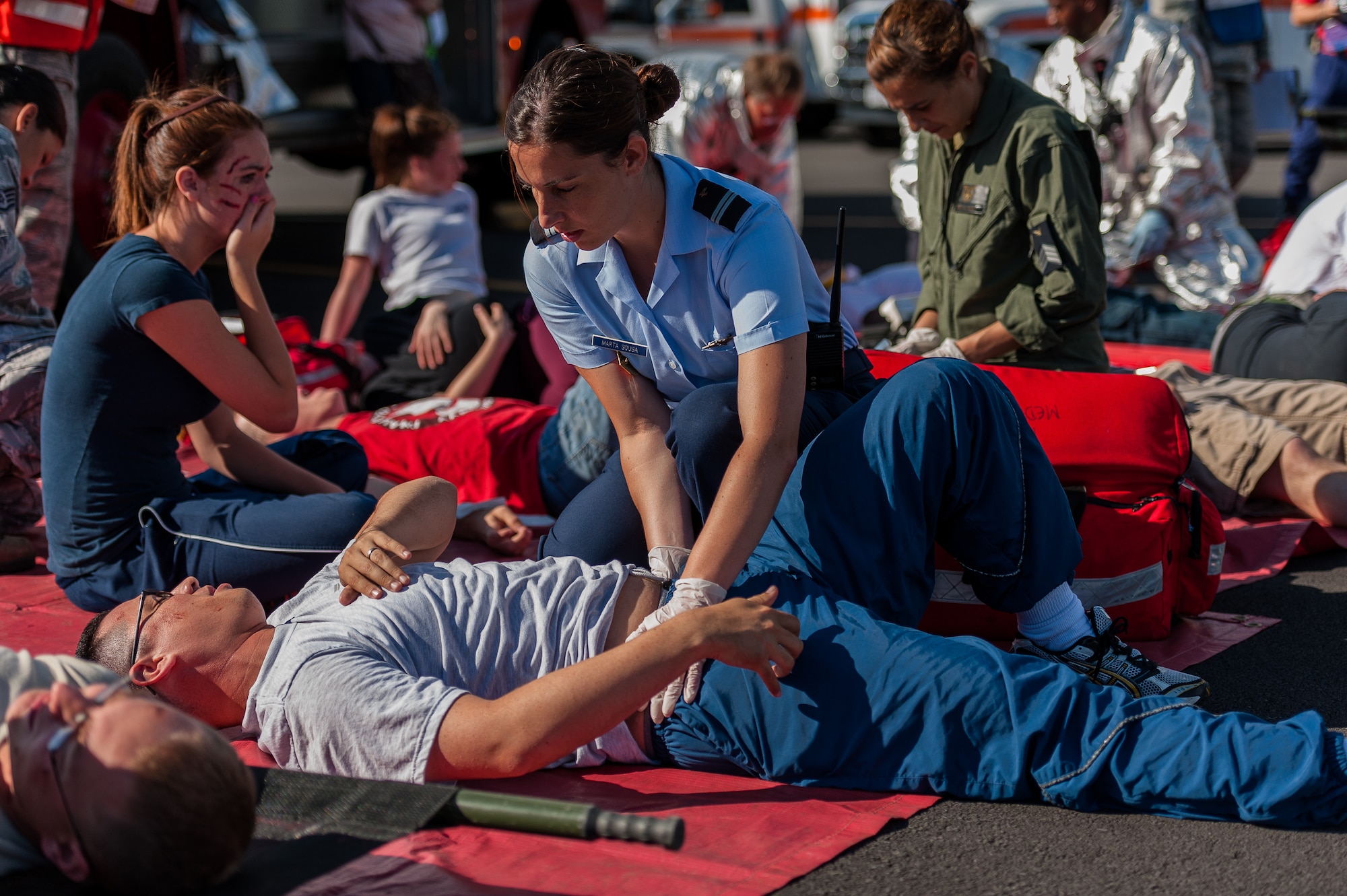 Portuguese Air Force Lt. Marta Sousa, Air Base 4 medic, checks simulated patient for broken bones during a joint exercise at Lajes Field, July 30 2012. Members of the Portuguese Air Force along with Lajes Airmen practiced their emergency readiness skills during a downed aircraft exercise prior to the upcoming Open House Aug. 5th.  (Photo by Lucas Silva)