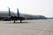 F-15E Strike Eagles taxi down the runway in preparation for takeoff during an operational readiness exercise on Seymour Johnson Air Force Base, N.C., July 26, 2012. During the exercise, the F-15Es simulated a deployment with the mission of eliminating all enemy threats and protecting Base X. (U.S. Air Force photo/Airman 1st Class John Nieves Camacho/Released)