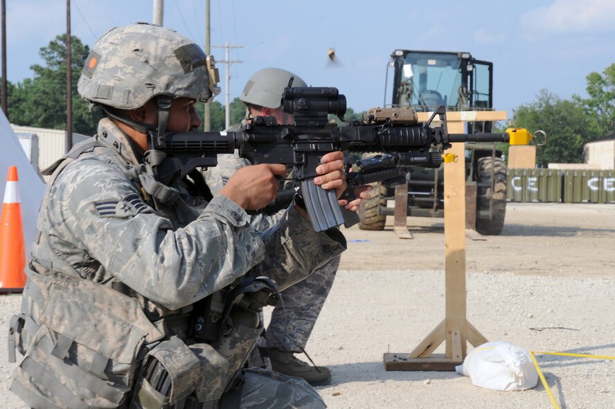 U.S. Air Force Senior Airman Matthew Watkins, 4th Security Forces Squadron force protector, opens fire in a simulated base attack during an operational readiness exercise on Seymour Johnson Air Force Base, N.C., July 26, 2012. Attacks were conducted on the base to see how security forces personnel responded to the threat and assisted the wounded. (U.S. Air Force photo/Airman 1st Class John Nieves Camacho/Released)