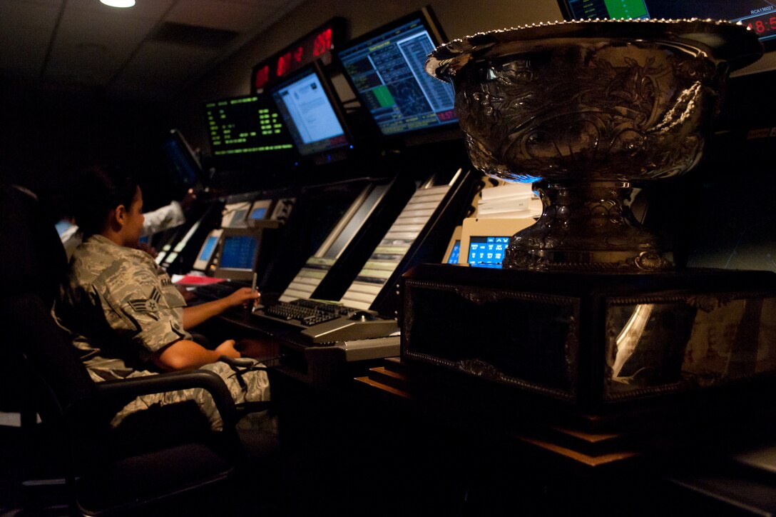 The Fairchild Trophy, presented to the best bomb wing in the U.S. Air Force, is proudly displayed in the 28th Operations Support Squadron Radar Approach Control facility on Ellsworth Air Force Base, S.D., July 17, 2012. The 28th Bomb Wing was presented the trophy during the Global Strike Command's Global Strike Challenge competition award ceremony at Barksdale Air Force Base, La., Nov. 9, 2011. Since that time they trophy has made several appearances at various facilities around Ellsworth to signify every Airman contributed to winning the best bomb wing title. (U.S. Air Force photo by Airman 1st Class Kate Thornton/Released)