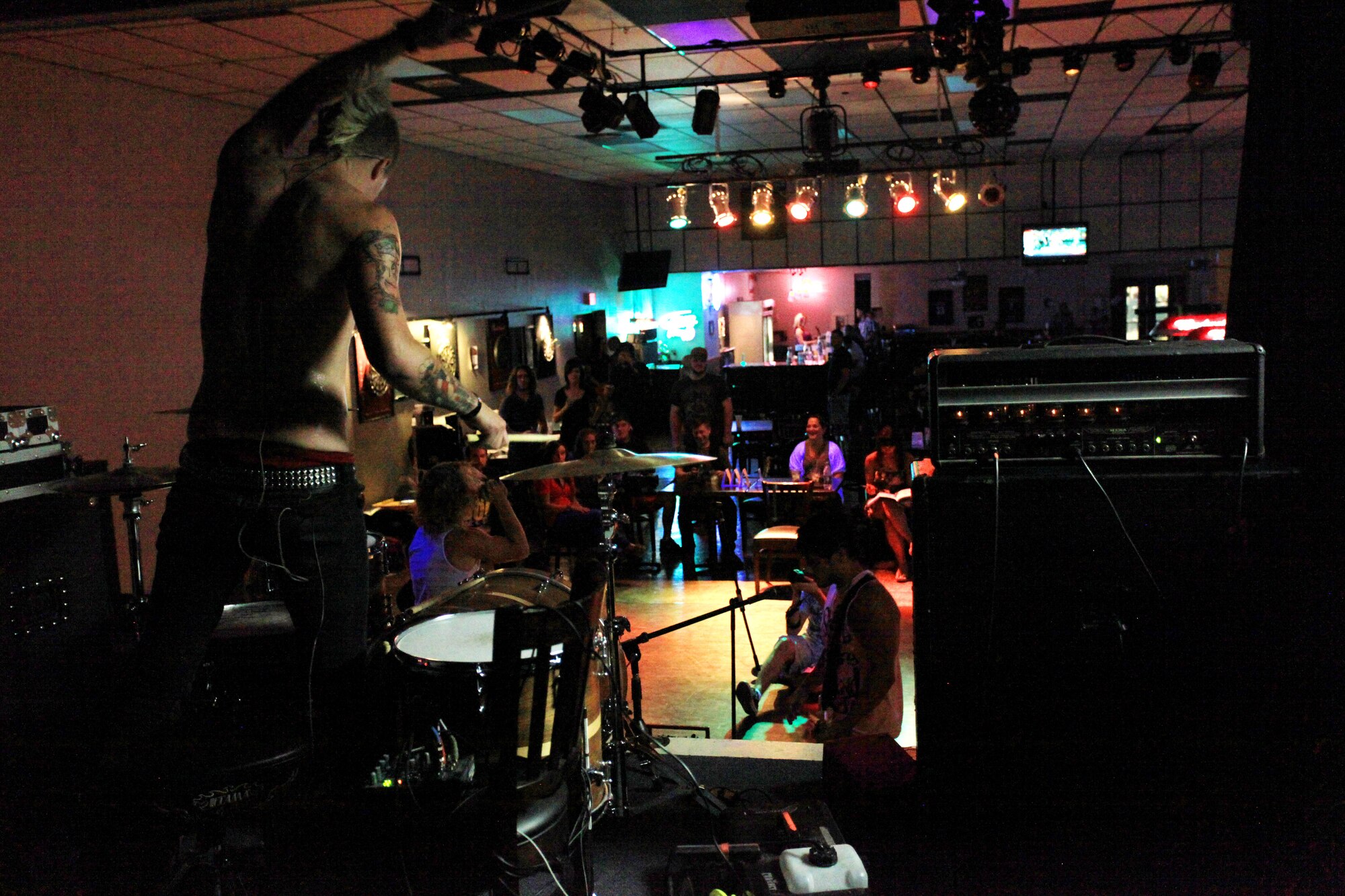 School Boy Humor band members perform live in the Drop Zone at Cannon Air Force Base, N.M., July 27, 2012. The EPIC Tour performance is part of a summer concert tour providing top-notch performances to military members across several states. (U.S. Air Force photo/Senior Airman Jette Carr) 