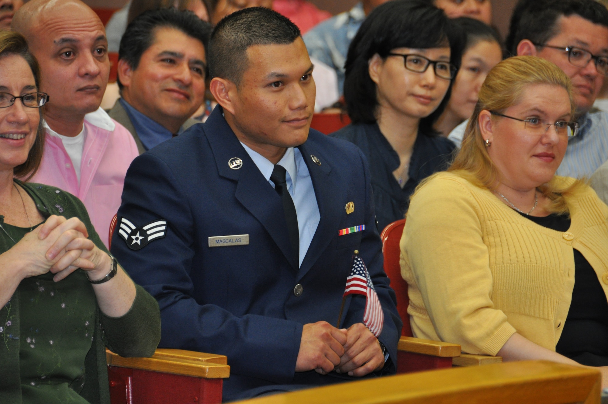 To become a U.S. citizen Senior Airman Noel Magcalas took the Oath of Allegiance during a Naturalization Ceremony in Anchorage July 27. Magcalas came to the U. S. in 1996 and joined the Air Force Reserve in 2010. He is one of 32,000 U.S. military members serving as legal residents in hopes of attaining citizenship. (U.S. Air Force Photo/Tech. Sgt. Dana Rosso) 