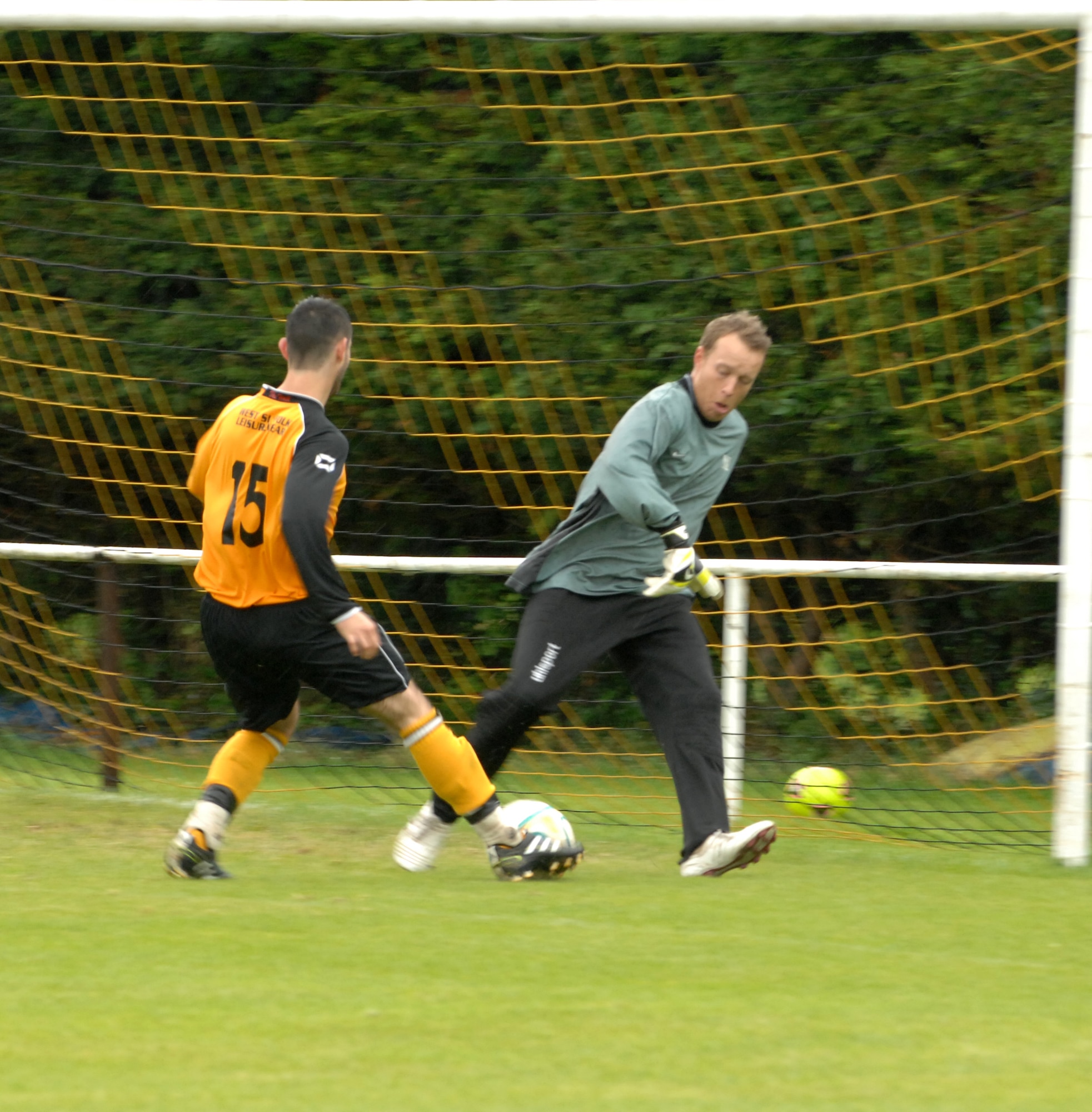 MILDENHALL, England – A player from the Mildenhall Town Football Club makes a shot on goal against the RAF Mildenhall soccer team during a match July 29, 2012 at the MTFC pitch in Mildenhall. The MTFC went on to score 13 more goals for a final score of 14-1. (U.S. Air Force photo/Senior Airman Rachel Waller)