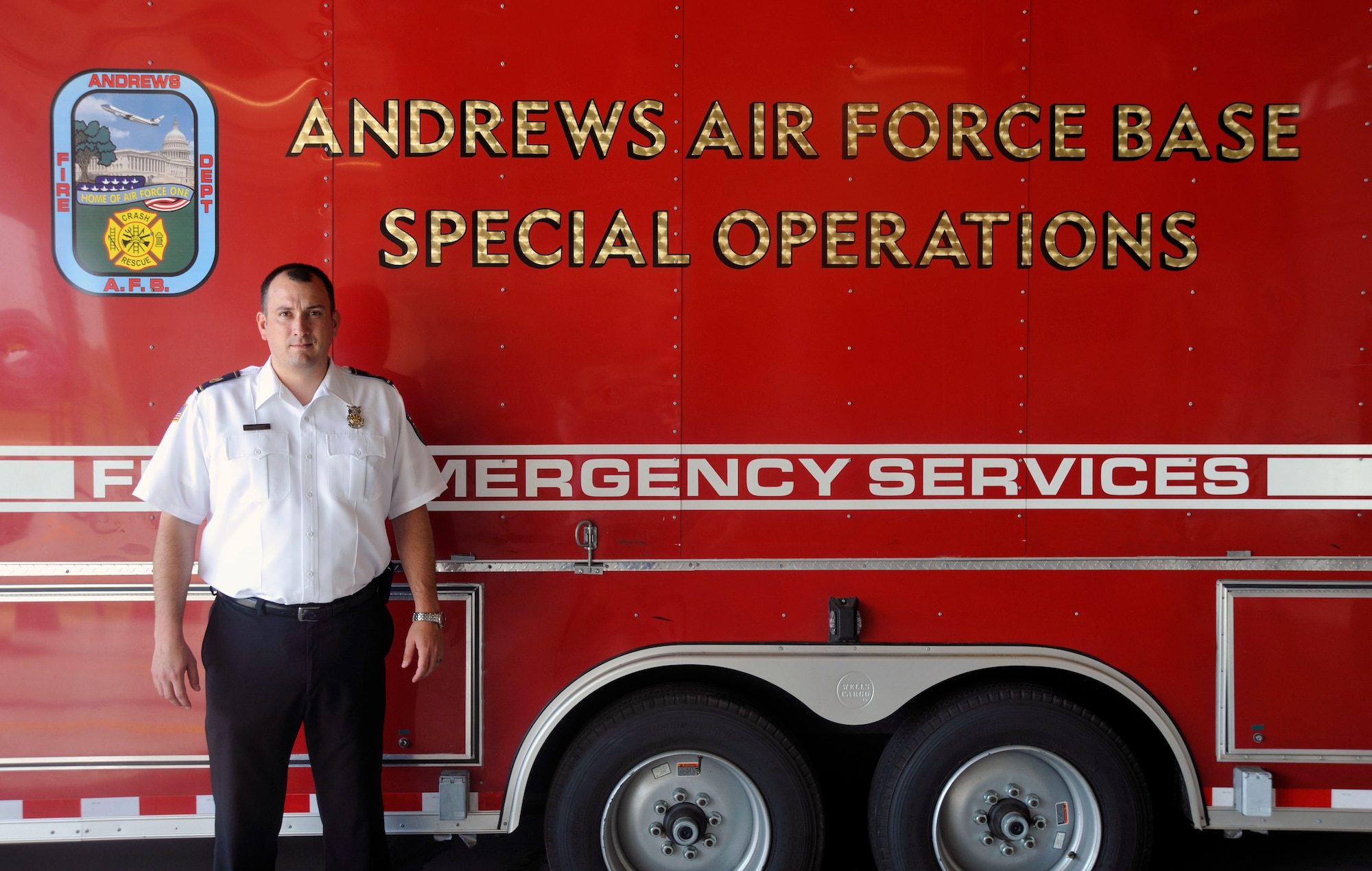 Mr. Jason Haddock, 11th Civil Engineer Squadron deputy fire chief and Air Force Civilian Program Specialist of the Year award recipient, poses for a photo outside Fire Station 1 on July 24, 2012. Haddock is one among 36,000 civilians currently working for the Air Force. (U.S. Air Force photo/Senior Airman Lindsey A. Porter)