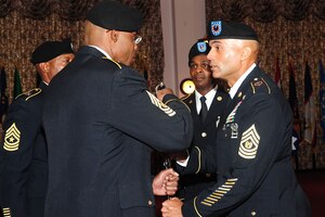 U.S. Army Command Sgt. Maj. Patrick Brooks (right) with the 7th Signal Command, presents the noncommissioned officers' sword to Command Sgt. Maj. Ricky Wallace, who is the incoming senior enlisted leader of the 93rd Brigade, during a change of responsibility ceremony at Fort Eustis, Va., July 27, 2012. Traditionally, the NCO sword represents a symbol of position of responsibility over an entire unit. (U.S. Air Force photo by Staff Sgt. Ashley Hawkins/Released)
