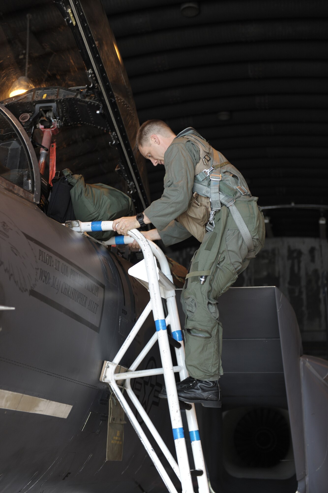 RAF LAKENHEATH, England - Master Sgt. Gabriel Browning, 422nd Communications Squadron, RAF Croughton, United Kingdom, climbs into an F-15E Strike Eagle as he prepares for his incentive flight July 27. Browning earned the flight as the 501st Combat Support Wing SNCO of the Year and his deployment where his unit lost nine people, including his boss and co-worker, to an Afghan gunman. (U.S. Air Force photo by Master Sgt. John Barton)