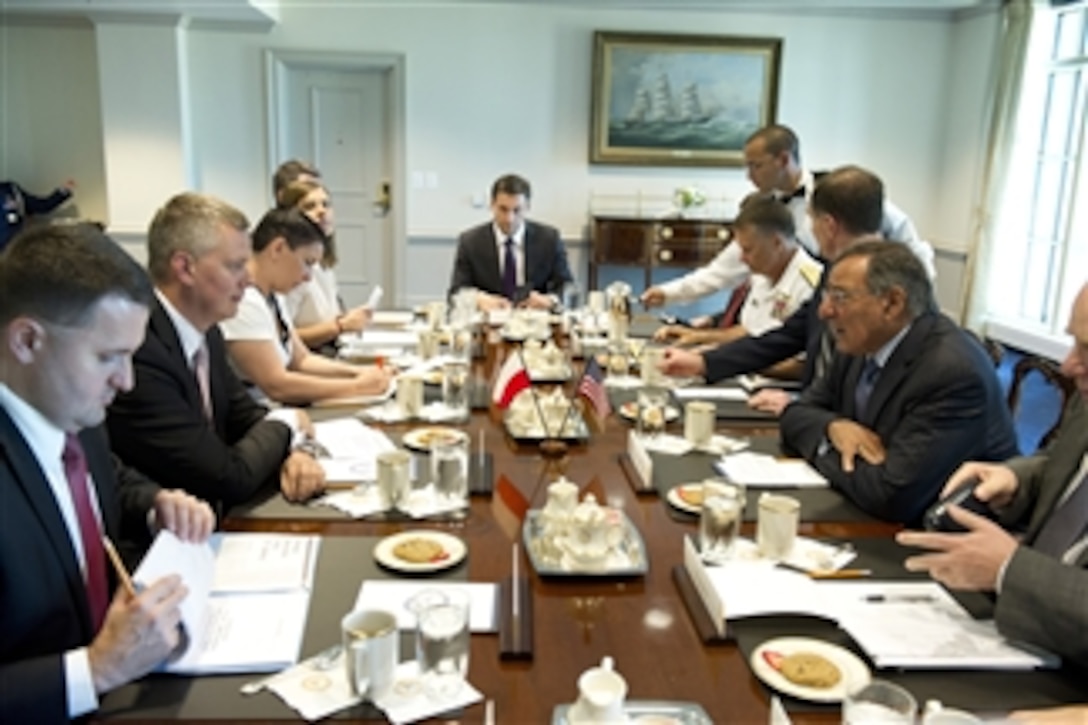 Secretary of Defense Leon Panetta, right, meets with Polish Minister of Defense Tomasz Siemoniak, second from left, in the Pentagon on July 25, 2012. Panetta, Siemoniak and their senior staff will meet to discuss issues of mutual interest to both nations.  