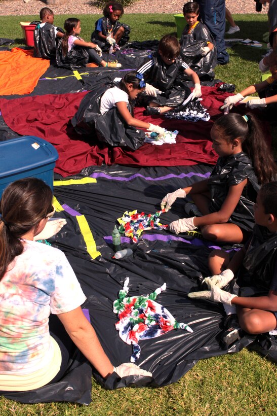 Children create tie dye t-shirts during day one of Camp Camo at the Paige Fieldhouse, July 30. Camp Camo is a four-day camp where young children ages seven to 11 learn about nutrition, exercise and how to be healthy during the summer.