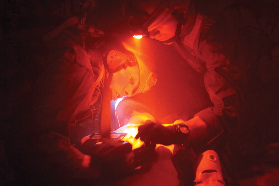 Corpsmen with 3rd Medical Battalion apply a bandage to a simulated casualty during the tactical combat casualty care course at the Tactical Medical Simulation Center at Camp Hansen June 29. 3rd Med. Bn. is part of Combat Logistics Regiment 37, 3rd Marine Logistics Group, III Marine Expeditionary Force.
