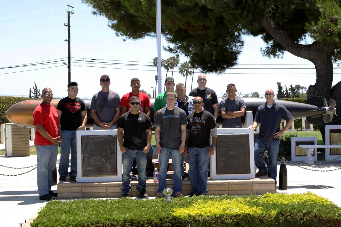 Marine Corps Base Camp Pendleton, Headquarters & Support Battalion’s motorcycle club poses in front of the World War II Submarine Memorial in Seal Beach, CA., Jul. 20. The H&S Bn. motorcycle club members are highly encouraged to go on the four to five organized group rides per year.