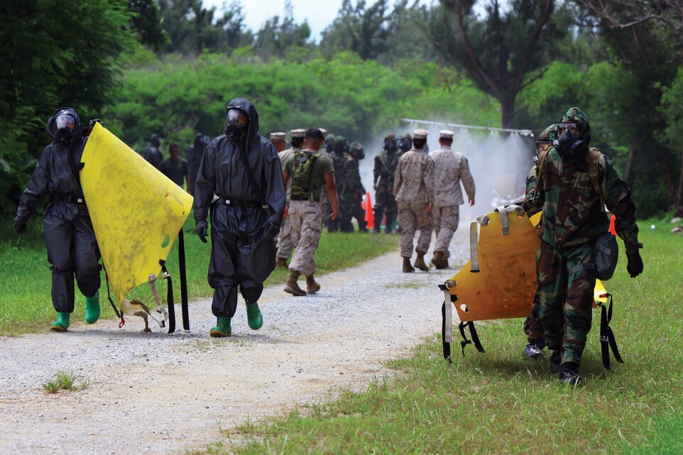 Marines with the 31st Marine Expeditionary Unit perform mass-casualty decontamination training at Kin Blue Beach training area July 11. The training was conducted to ensure the 31st MEU is ready to respond to potential chemical, biological, radiological and nuclear threats in the Asia-Pacific region. The Marines taking part in the training are with Combat Logistics Regiment 31 and the command element of the 31st MEU, III Marine Expeditionary Force. 