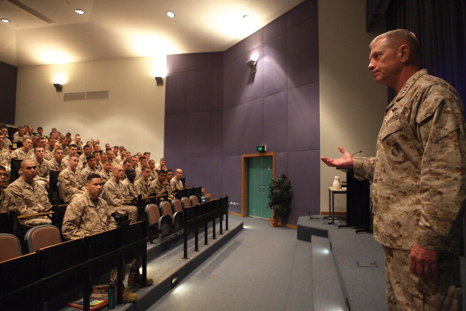 Lt. Gen. Kenneth J. Glueck speaks to the Marines of Marine Rotational Force-Darwin at Robertson Barracks July 16 during a visit to Australia. During his visit, Glueck also met with Brigadier Fergus McLachlan and toured the facilities currently being used by MRF-D. (The Marines) have done an absolutely superb job being the leading edge of the rotational force and paving the road for the future in Southeast Asia, said Glueck. MRF-D consists of Company F, 2nd Battalion, 3rd Marine Regiment, 3rd Marine Division, III Marine Expeditionary Force, and various support personnel, and is scheduled to conduct training with the Australian Army near Darwin until late September. Glueck is the commanding general of III MEF. McLachlan is the commander of the Australian Army's 1 Brigade. 