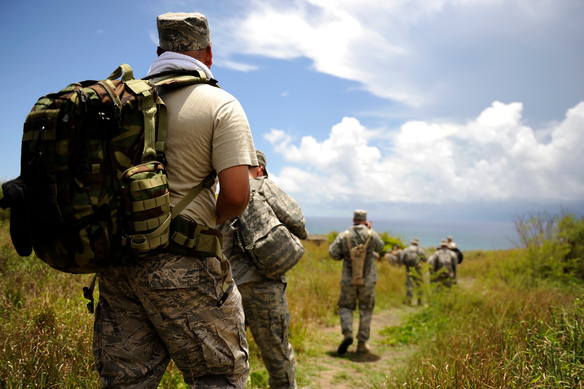 U.S. Air Force Airmen from the 18th Maintenance Group march toward the coast of Iwo To, Japan, formerly known as Iwo Jima, July 26, 2012. During World War II, Iwo Jima was primarily used by the U.S. Army Air Forces as a strategic midway point between Okinawa and Honshu island, Japan. Overall, a total of 2,251 B-29 emergency landings on the island were recorded during the war. Similarly, 1,191 fighter escorts and 3,081 strike sorties were flown from Iwo Jima against Japan. (U.S. Air Force photo/ Airman 1st Class Maeson L. Elleman)