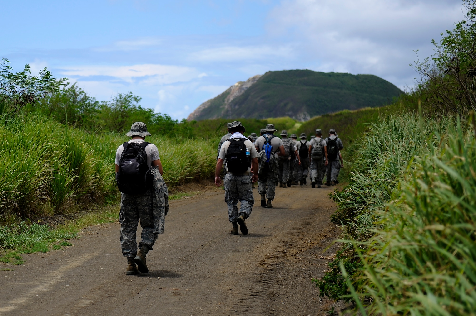 U.S. Air Force Airmen from the 18th Maintenance Group march toward Mount Suribachi as part of a tour of Iwo To, Japan, formerly known as Iwo Jima, conducted by the 18th Wing History Office July 26, 2012. Because the island remains off-limits to most civilian personnel due to dangers still hidden on the battle site, the trip has become a once-in-a-lifetime opportunity for anyone given the opportunity. (U.S. Air Force photo/ Airman 1st Class Maeson L. Elleman)