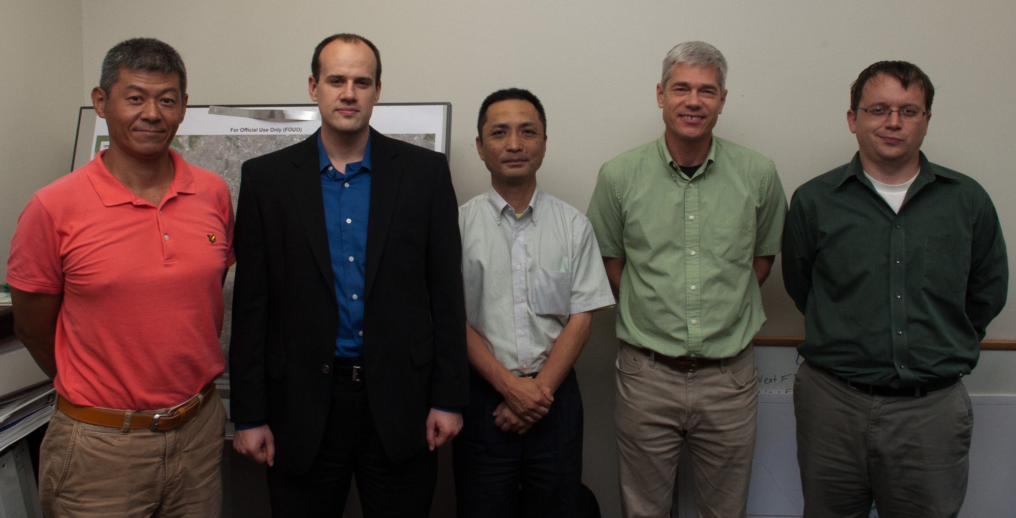 YOKOTA AIR BASE, Japan -- From left to right, Hisashi Hashimoto, 374th Civil Engineer Squadron utilities data specialist; Christopher Cook, 374th CES energy manager; Miyano Masashi, 374th CES mechanical engineer technician; David Lochtefeld, 374th CES resource efficiency manager; and Andrew Wright, 374th CES chief of asset optimization, make up the 374th CES energy management team that recently won the 2012 Federal Energy and Water Management Award. The team recieved the award after implementing several energy saving programs on base, reducing Yokota’s wasted energy by 4.7 percent from the previous year and 17.6 percent since 2003. (U.S. Air Force photo by Airman 1st Class John D. Partlow)