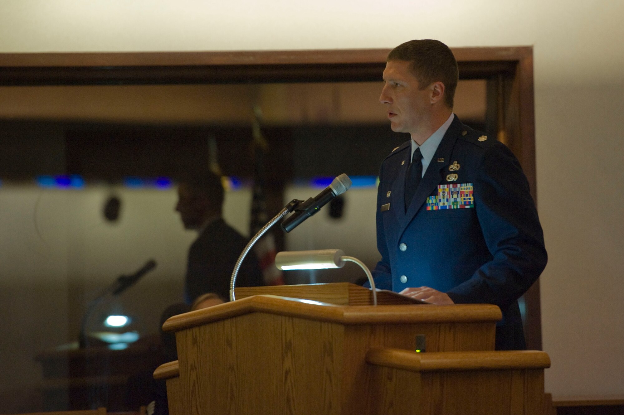 U.S. Air Force Lt. Col. William Ray, 757th Aircraft Maintenance Squadron commander, speaks about his condolences to the family of Senior Airman Derek Moore, 757th Aircraft Maintenance Squadron electrical and environmental systems journeyman, during a memorial service July 27, 2012, at Nellis Air Force Base, Nev. Moore worked various shifts as an E&E journeyman in the squadron. (U.S. Air Force photo by Airman 1st Class Christopher Tam)