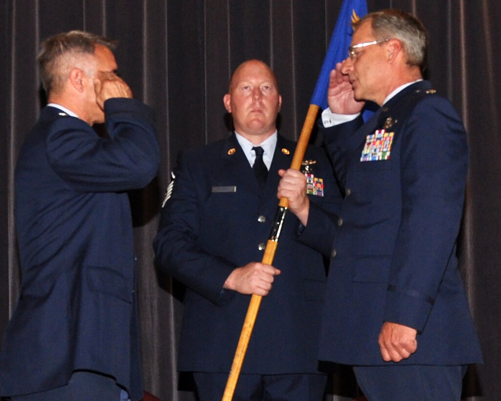 Lt. Colonel Donald Langiewicz, 328th Airlift Squadron Commander (right) salutes Col. Paul Sprenkle, 914th Operations Group Commander, while Master Sgt. Frank Yamonaco, 328th Airlift Squadron First Sergeant, holds the Squadron Guidon during a change of command ceremony on July 7, 2012 at the Niagara Falls Air Reserve Station, N.Y.  Lt. Colonel Langiewicz assumed command of the 328th Airlift Squadron.  (U.S. Air Force photo by Staff Sgt. Stephanie Clark) 