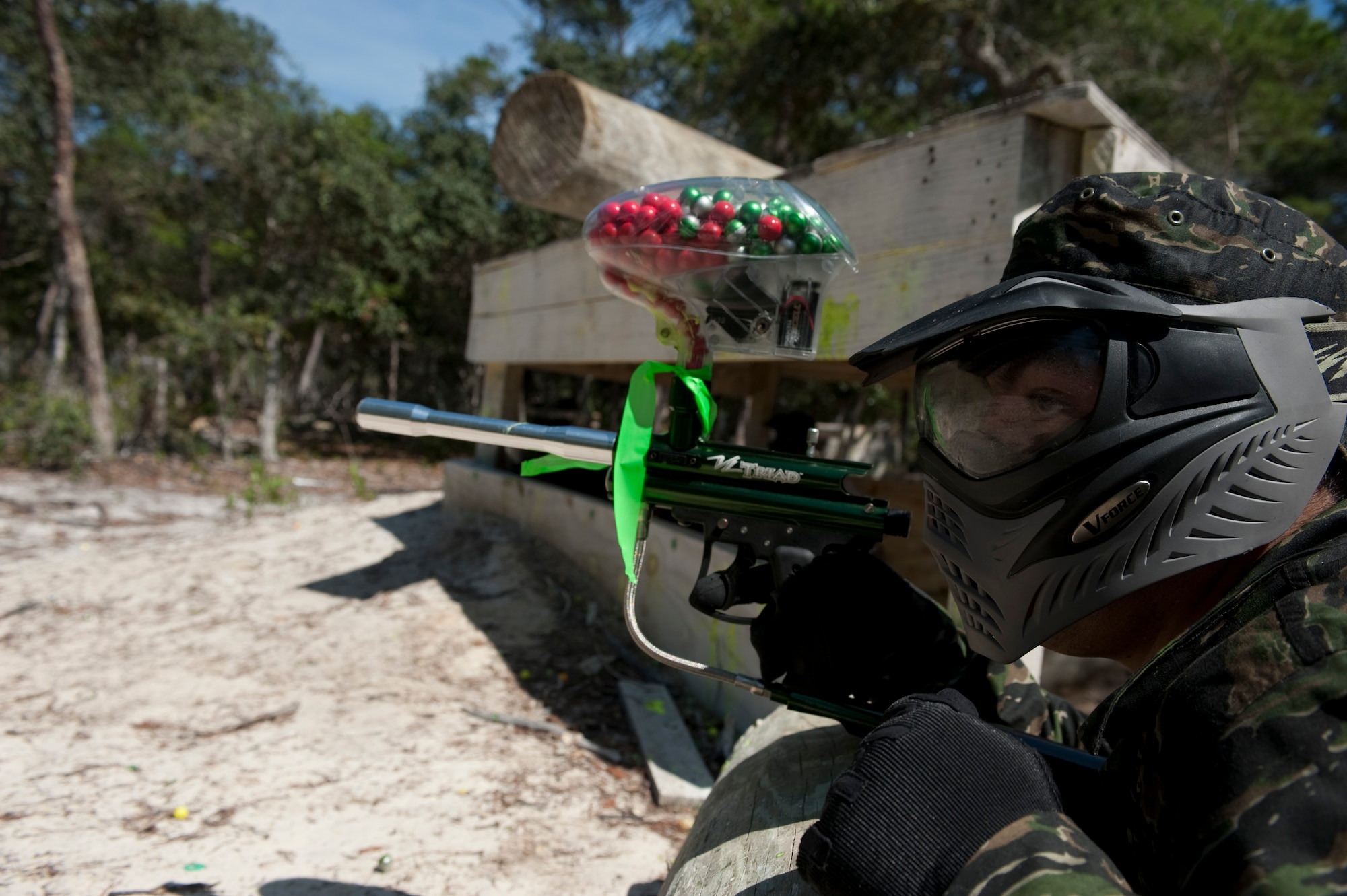 U.S. Air Force Senior Airman Jesus Torres, aerospace propulsion journeyman from 1st Special Operations Component Maintenance Squadron, scans the horizon at the paintball field, Hurlburt Field, Fla., July 27, 2012. While the Airmen dominated the chiefs with their superior numbers in the initial match of attack and defend, many said they appreciated the participation of the chiefs and first sergeants.  (U.S. Air Force Photo/Airman 1st Class Hayden K. Hyatt)
