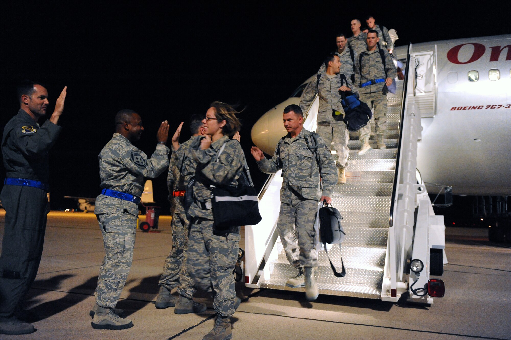 Airmen are greeted by Dyess leadership July 25, 2012, after returning from a six-month deployment to Southwest Asia. More than 400 Airmen deployed in support of Operation Enduring Freedom. The deployment marked the largest B-1 Bomber deployment of aircraft and personnel in the last 10 years. (U.S. Air Force photo by Senior Airman Robert Hicks/Released)