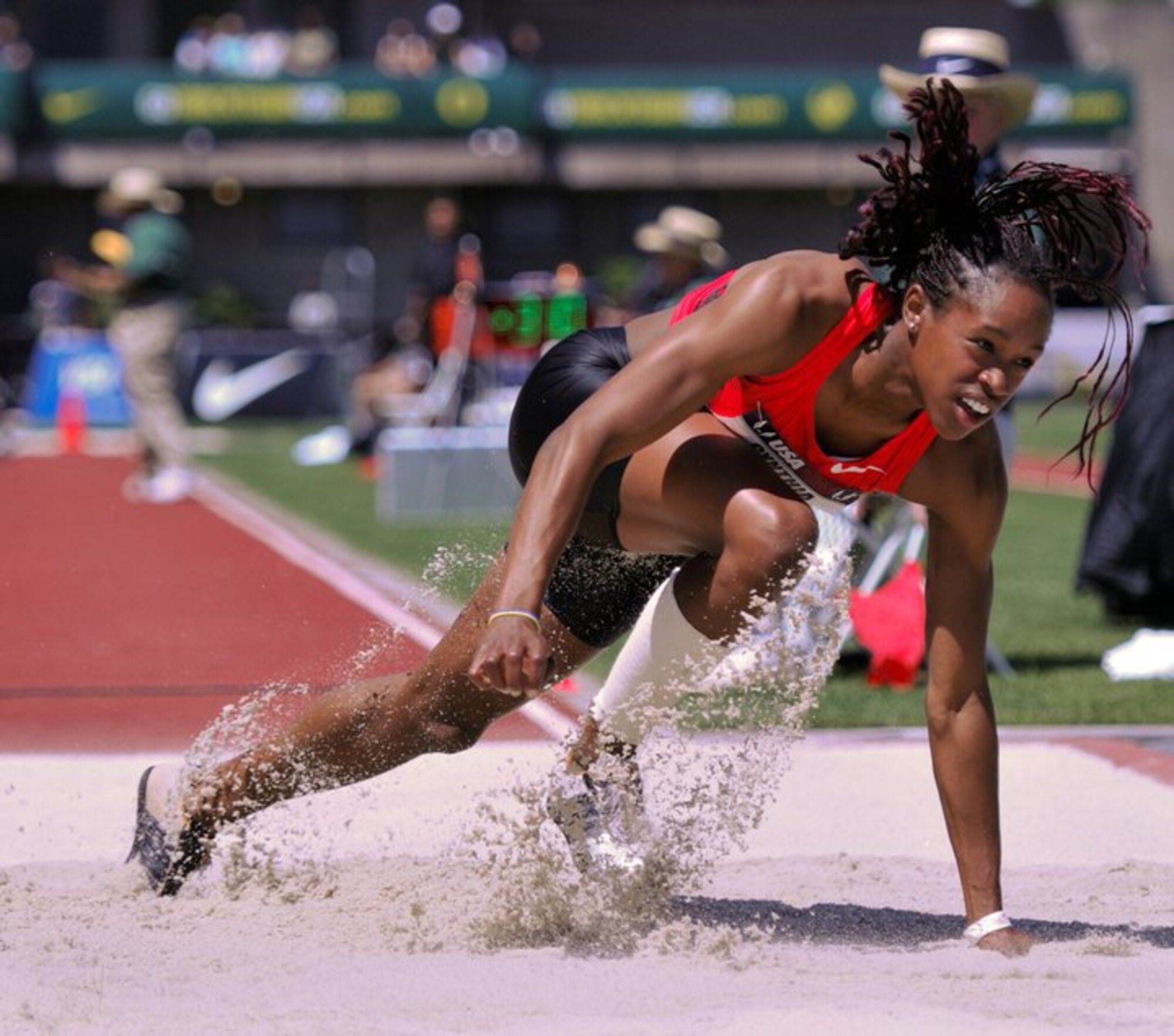 Janay, daughter of retired Air Force chief master sergeant William DeLoach and his wife Dede, practices her long jump, which earned her a place in the London 2012 Olympic Games. Janay was immersed in Air Force culture and values as she traveled in support of her father's career for 18 years. Those values, which shaped her life continue to guide her today as she goes for gold in the Women's Long Jump competition. (Courtesy Photo by JanayDeLoach.com)