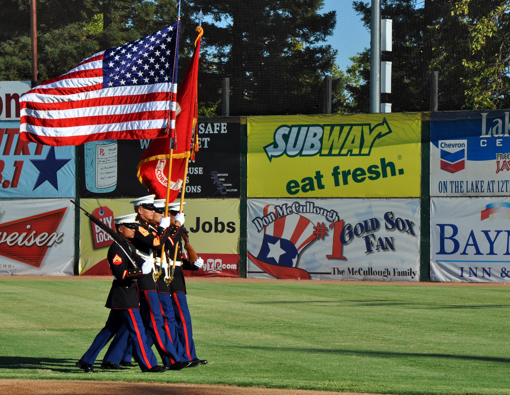Members of a U.S. Marine Corps color guard perform during the opening ceremonies of Military Appreciation Night at a Marysville Gold Sox game at Appeal-Democrat Park, Marysville, Calif., July 29, 2012. The color guard was from a reserve unit in Sacramento. (U.S. Air Force photo by Staff Sgt. Robert M. Trujillo)