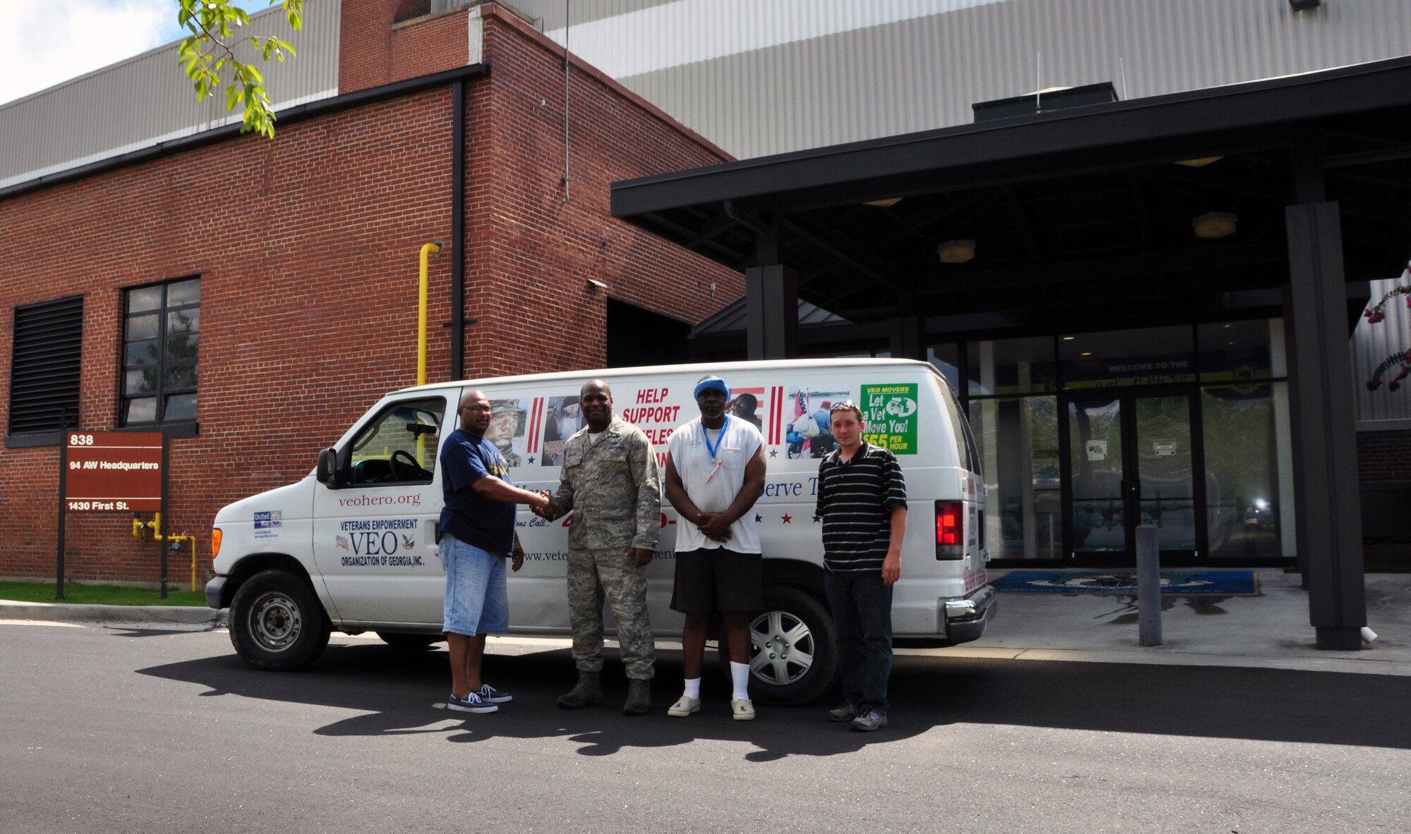 Capt. Darrell Bogan, 94th Airlift Wing equal opportunity director, met with members of Veteran's Empowerment Organization of Georgia on July 27 on base to load up 202 pounds of food collected as part of the Feds Feed Families initiative. This program has been in effect around Dobbins Air Reserve Base throughout the Summer and will conclude at the end of Aug. (U.S. Air Force photo/Senior Airman Elizabeth Van Patten)