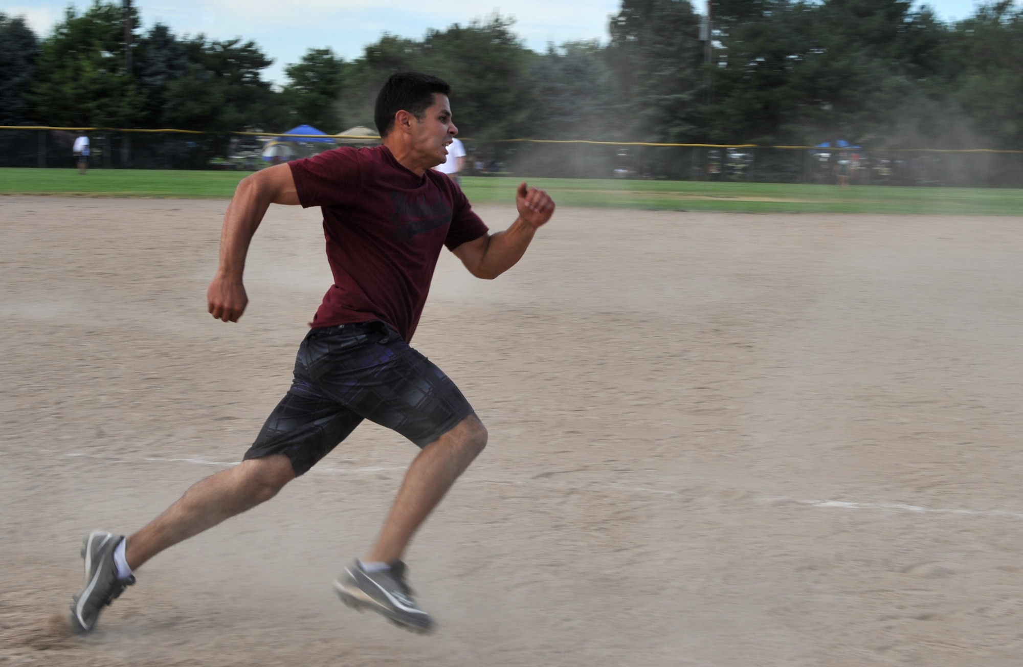 U.S. Air Force Senior Airman William Tibbetts, 366th Comptroller Squadron budget analyst, runs to home base to score a point for his team that made first place out of the teams from the base during the Operation Warmheart softball tournament July 27, 2012, at Mountain Home Air Force Base, Idaho. Tibbetts was part of the Woodchucks team, which finished fifth place overall out of 26 teams. (U.S. Air Force photo/Airman 1st Class Heather Hayward)