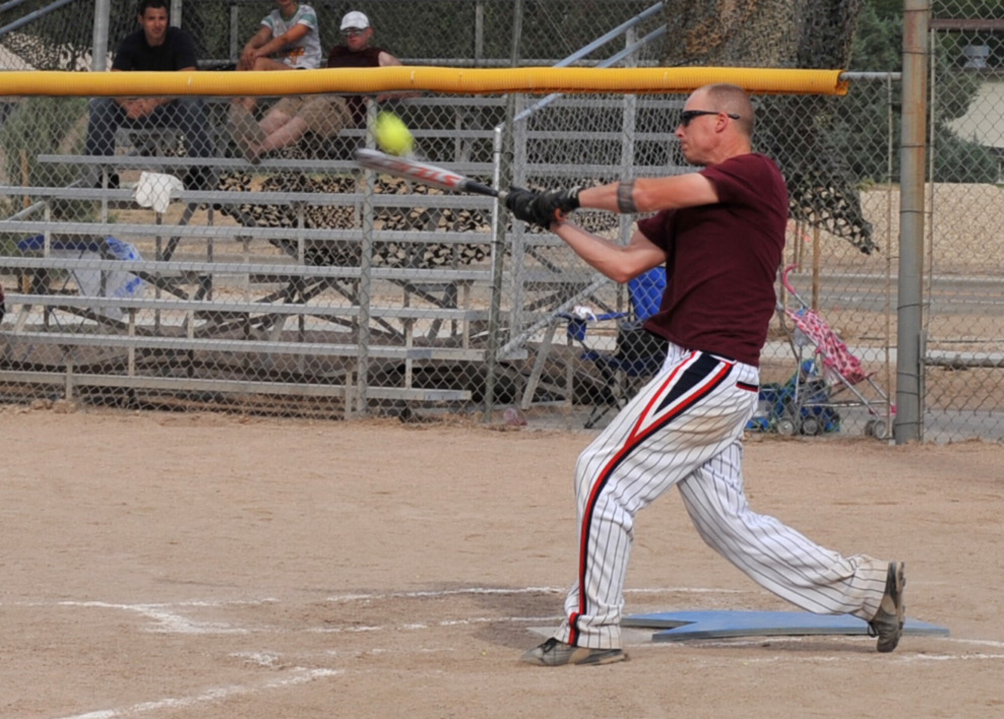 U.S. Air Force Staff Sgt. Jason Brown, 366th Command Post controller, gets a base hit during the Operation Warmheart softball tournament July 27, 2012, at Mountain Home Air Force Base, Idaho. The proceeds from the tournament will benefit needy Airmen and their families with things such as offsetting the cost of plane tickets when a family member passes away. (U.S. Air Force photo/Airman 1st Class Heather Hayward)