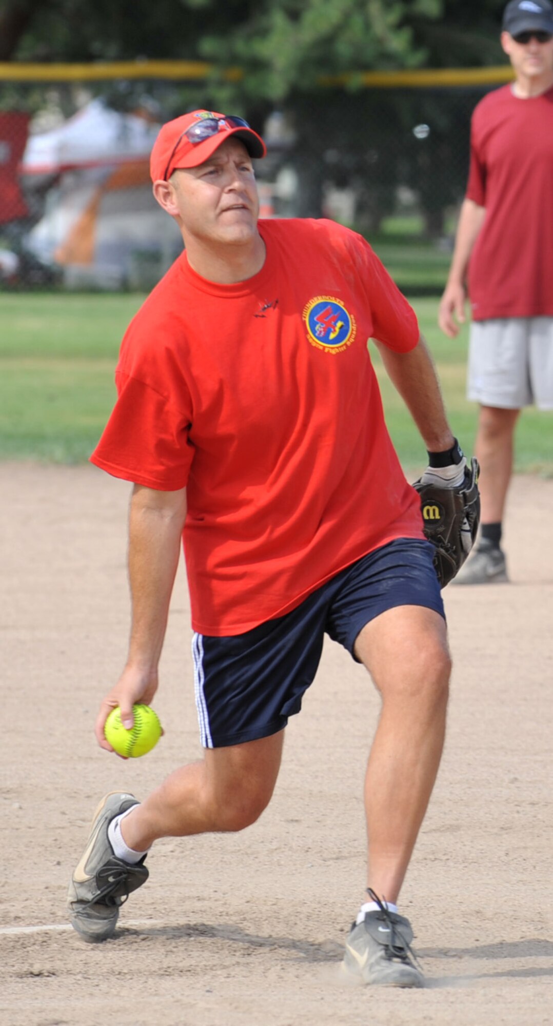 U.S. Air Force Col. Christopher Short, 366th Fighter Wing commander, throws the opening pitch for the Operation Warmheart softball tournament July 27, 2012, at Mountain Home Air Force Base, Idaho. The first game was played by the commanders versus the first sergeants and chiefs, and ended in a tied score of eight to eight. (U.S. Air Force photo/Airman 1st Class Heather Hayward)