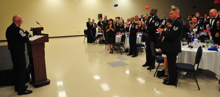 Team Fairchild members give 6th Chief Master Sergeant of the Air Force James McCoy a standing ovation after he is introduced by Chief Master Sgt. Rudy Lopez, 92nd Air Refueling Wing command chief, during the Senior NCO Induction Ceremony July 27, 2012 in the Armed Forces Reserve Center at Fairchild Air Force Base, Wash. McCoy was the guest speaker for the ceremony and shared with the audience on what made him serve, strive and become the best he could when he was enlisted. (U.S. Air Force photo by Airman 1st Class Earlandez Young)