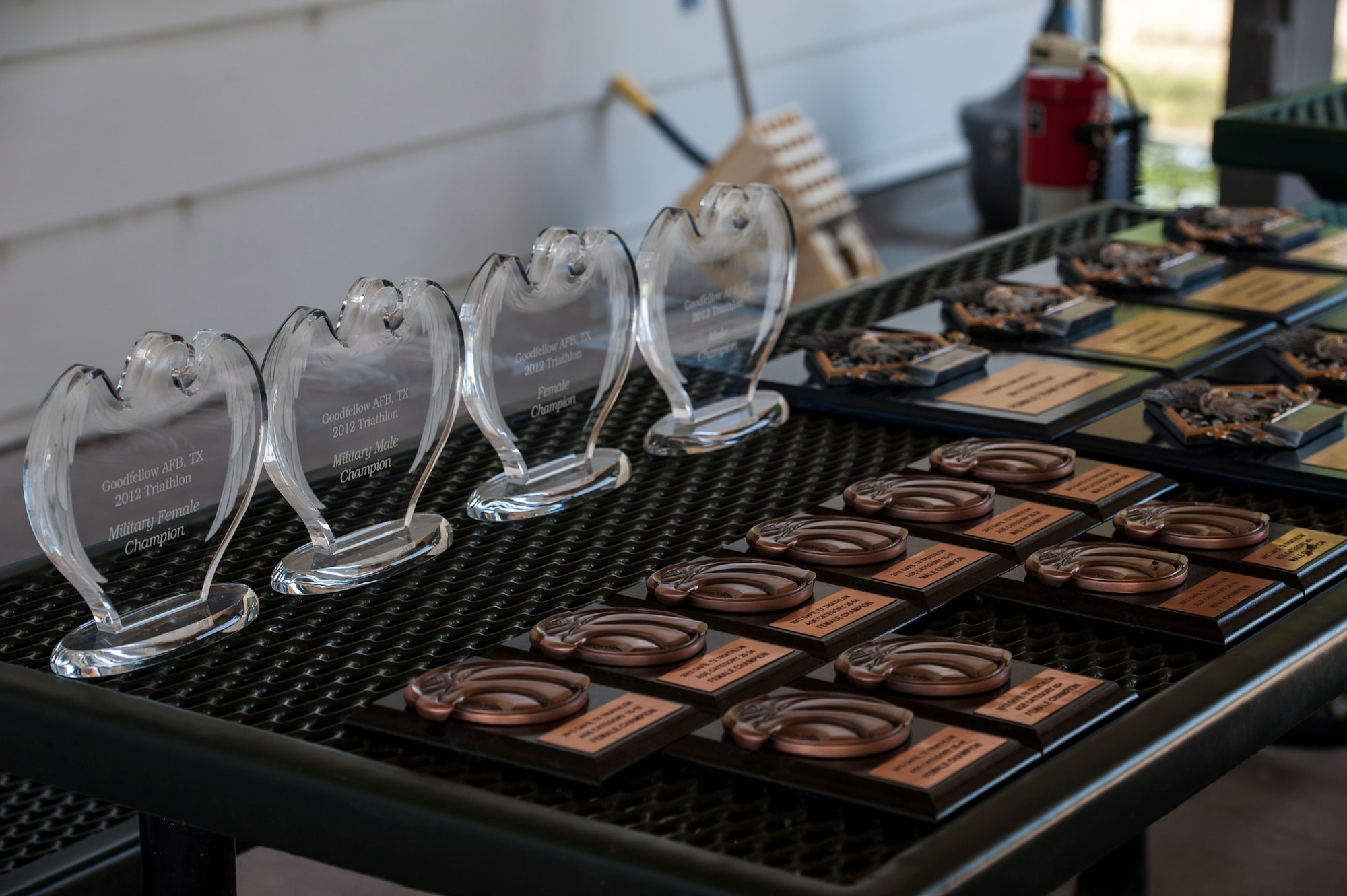 GOODFELLOW AIR FORCE BASE, Texas-- The trophies from the 2012 Goodfellow Triathlon sit on a table at the Outdoor Recreation Camp July 28. The triathlon, open to military and the community, was comprised of a 400-meter swim, 20-kilometer bike ride, and a 5-kilometer run. (U.S. Air Force photo/Airman 1st Class Michael Smith)