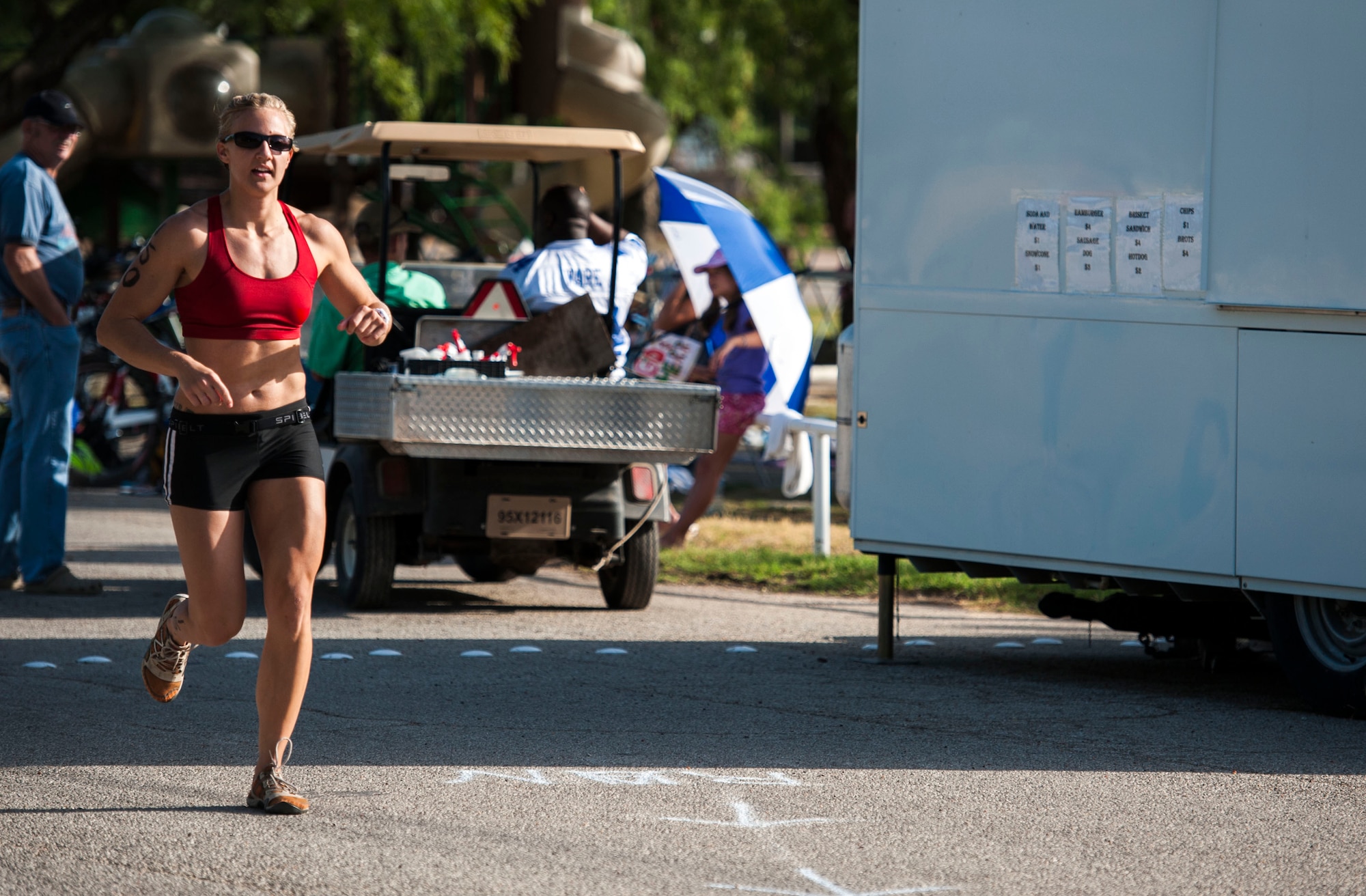 GOODFELLOW AIR FORCE BASE, Texas-- 2nd Lt. Kaylee Martin, 315th Training Squadron, begins the run portion of the Goodfellow Triathlon at the Outdoor Recreation Camp July 28. The triathlon, open to military and the community, was comprised of a 400-meter swim, 20-kilometer bike ride, and a 5-kilometer run. (U.S. Air Force photo/Airman 1st Class Michael Smith)