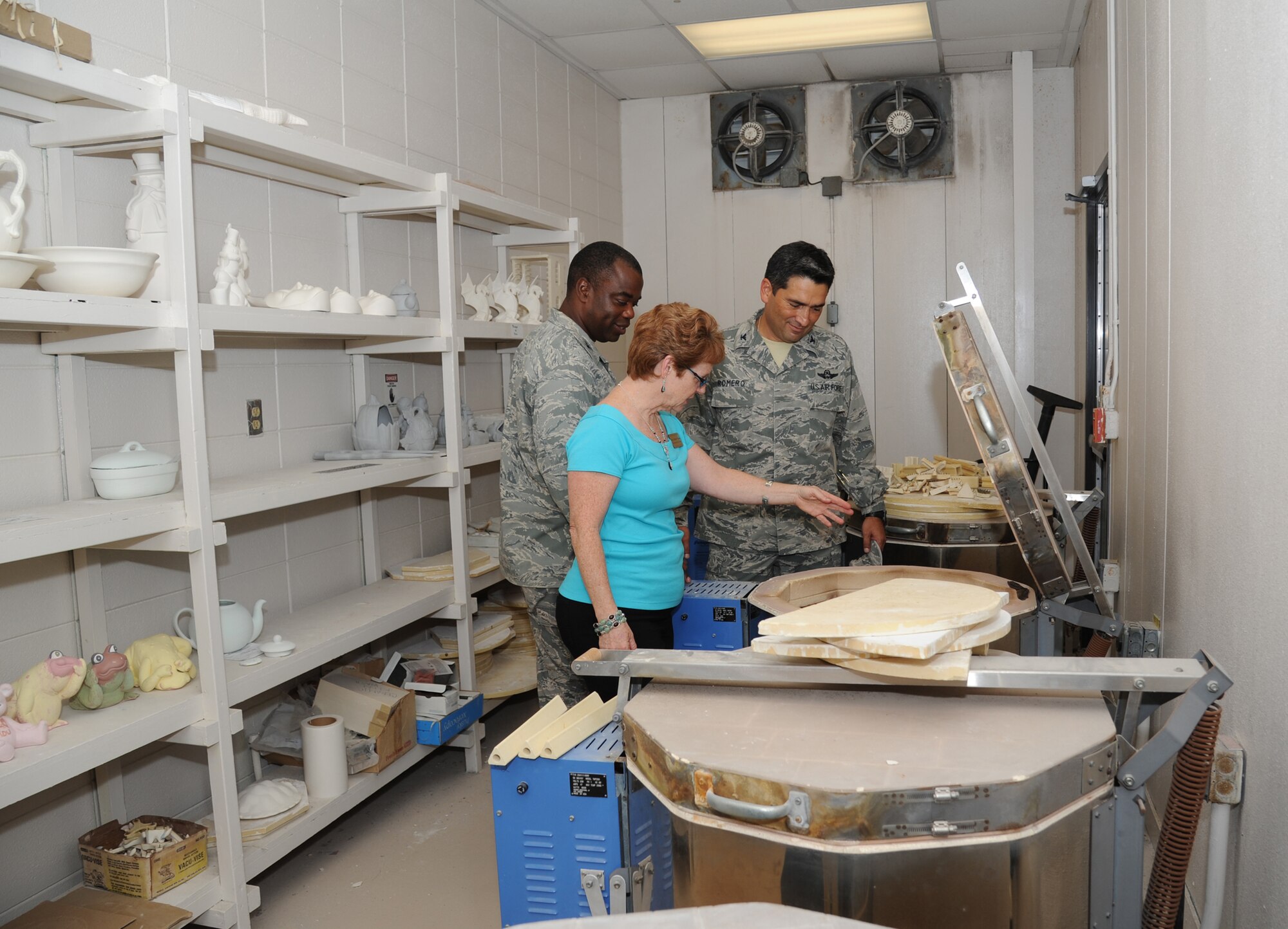 Debra Pearson, Arts and Crafts director, explains how a kiln works to Col. Mark Vivians, 81st Mission Support Group commander, and Col. Rene Romero, 81st Training Wing vice commander, during a one-day immersion tour of the 81st Mission Support Group, July 24, 2012, Keesler Air Force Base, Miss.  (U.S. Air Force photo by Kemberly Groue)