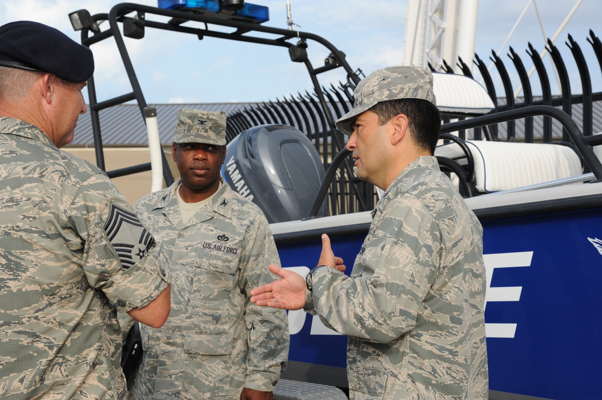 Chief Master Sgt. Jeffery Bryant, 81st Security Forces Squadron, provides a briefing on the 81st SFS’s police boat to Col. Mark Vivians, 81st Mission Support Group commander, and Col. Rene Romero, 81st Training Wing vice commander, during a one-day immersion tour of the 81st MSG, July 24, 2012, Keesler Air Force Base, Miss.  (U.S. Air Force photo by Kemberly Groue)