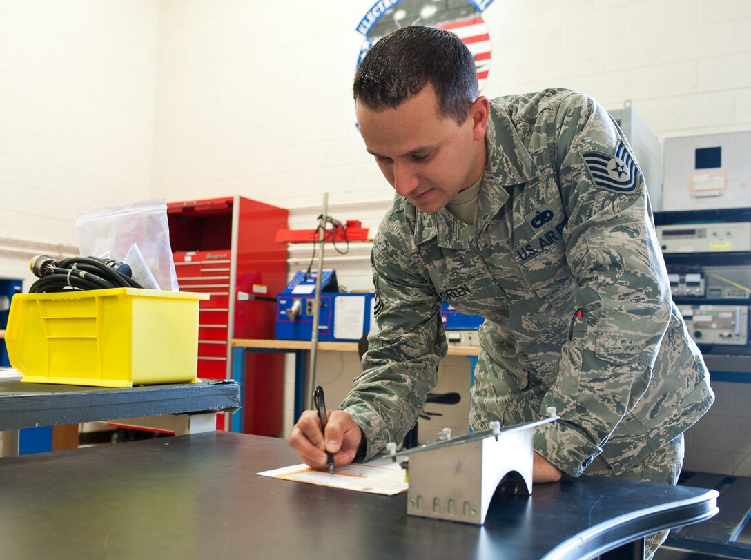 Tech. Sgt. Paul Green, 28th Maintenance Squadron electro-environmental section chief, performs a quality check of a foreign object and debris band cover at Ellsworth Air Force Base, S.D., July 27, 2012. The 28th MXS electro-environmental shop is responsible for maintaining all electrical and environmental parts of the base’s B-1 fleet. (U.S. Air Force photo by Airman 1st Class Alystria Maurer/Released)