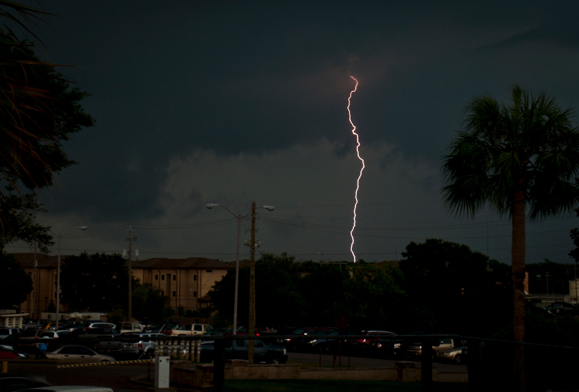 A large-scale summer storm moves toward Eglin Air Force Base, Fla., July 30, bringing winds, rain and lightning.  The thunderstorm moved in from the Southeast and drenched the base for an hour and a half late in the day.  A similar storm rolled through the morning of July 31 as well.  (U.S. Air Force photo/Samuel King Jr.)
