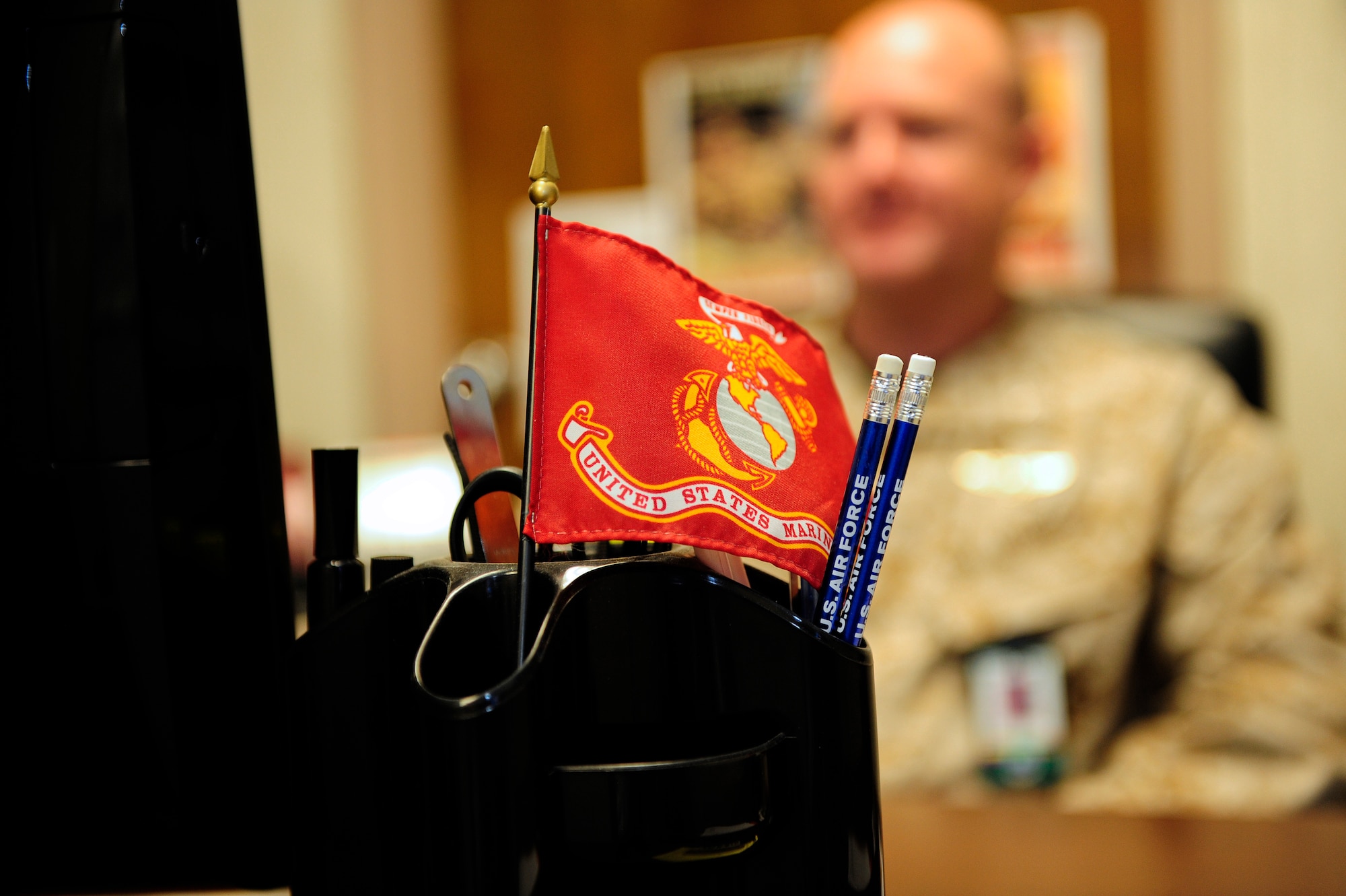 United States Marine Corps Central Command, as well as U.S. Air Force Central, cooperate in numerous missions involving large quantities of manpower, time and resources. To do so, there must be communication and coordination, and Col. John Bateman, MARCENT liaison officer to AFCENT ensures the accurate and timely delivery of such information between the two services. (U.S. Air Force photo by Airman 1st Class Daniel Blackwell/Released)