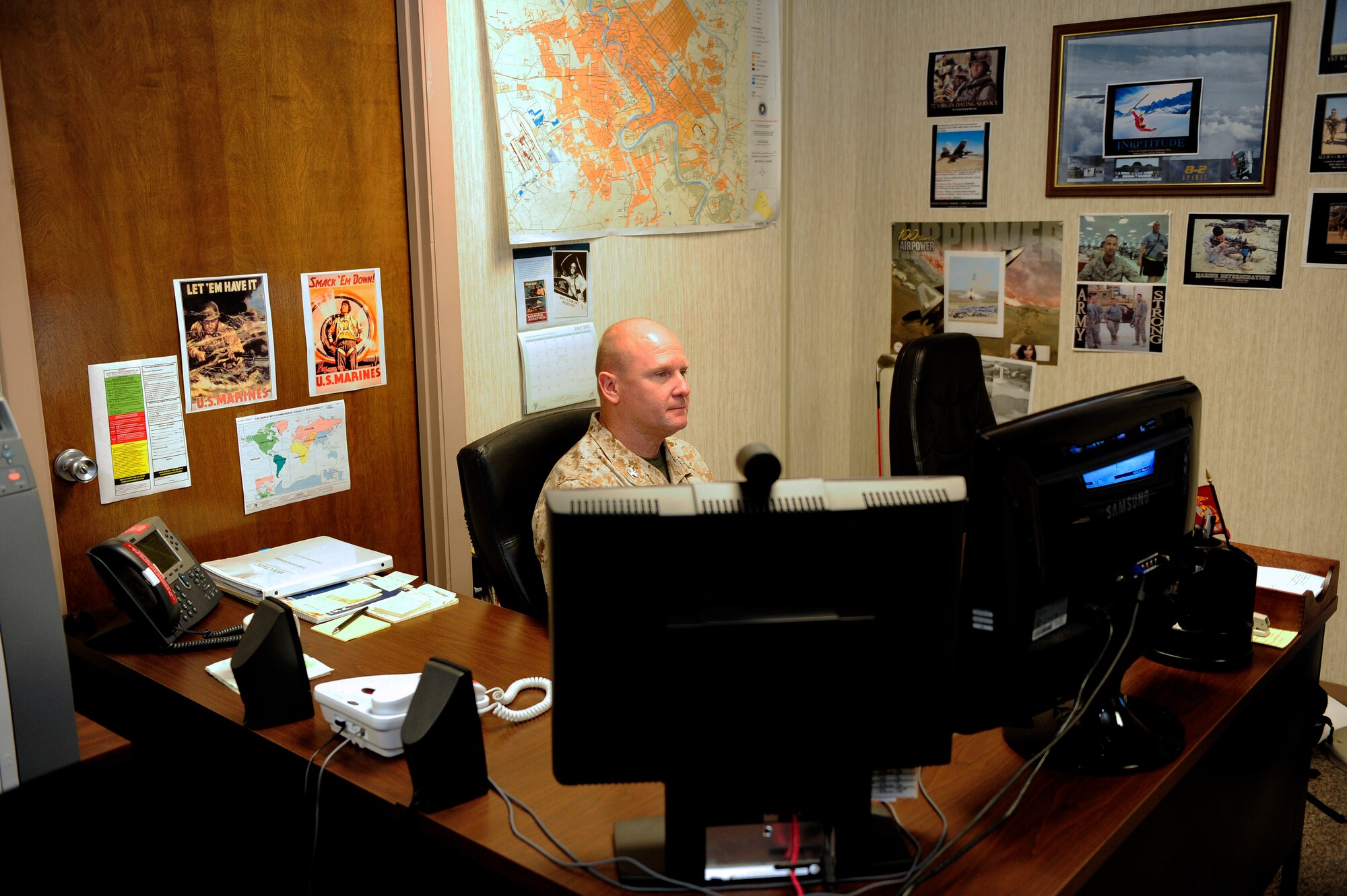 Colonel John Bateman, U.S. Marine Corps Central Command liaison officer to U.S. Air Force Central, checks his emails and catches up on work. As the MARCENT liaison to AFCENT, Bateman must frequently check his emails and schedule to ensure he keeps all lines of communication open and available for his daily duties. (U.S. Air Force photo by Airman 1st Class Daniel Blackwell/Released)