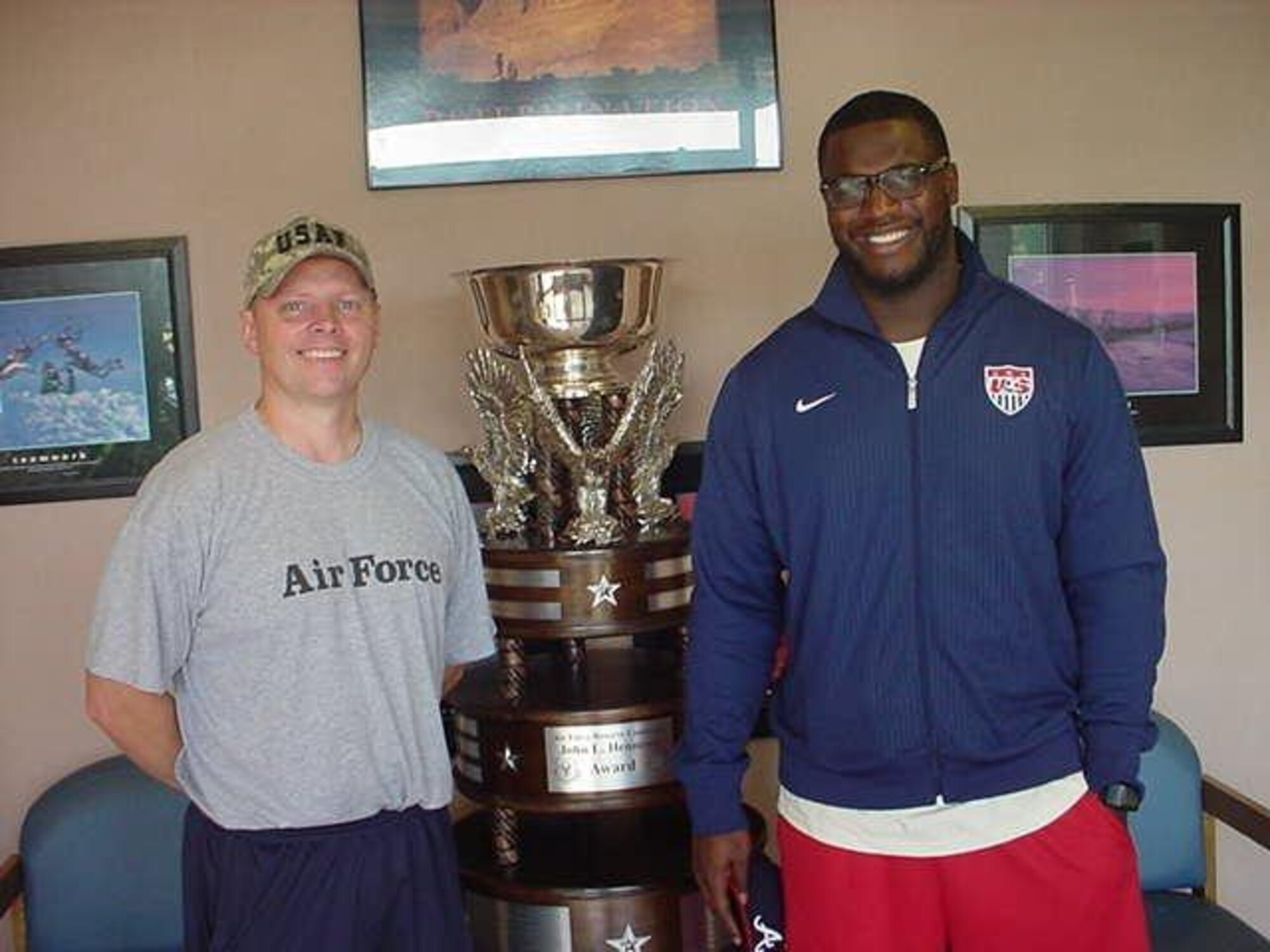 John Mikula, Dobbins Air Reserve Base exercise physiologist, and Rashad Roberts, Panthers assistant strength coach, reengaged in a discussion about similarities between the NFL and military training needs. Mikula makes a regular habit of communicating with others who excel in his field to learn new practices. (Courtesy photo)