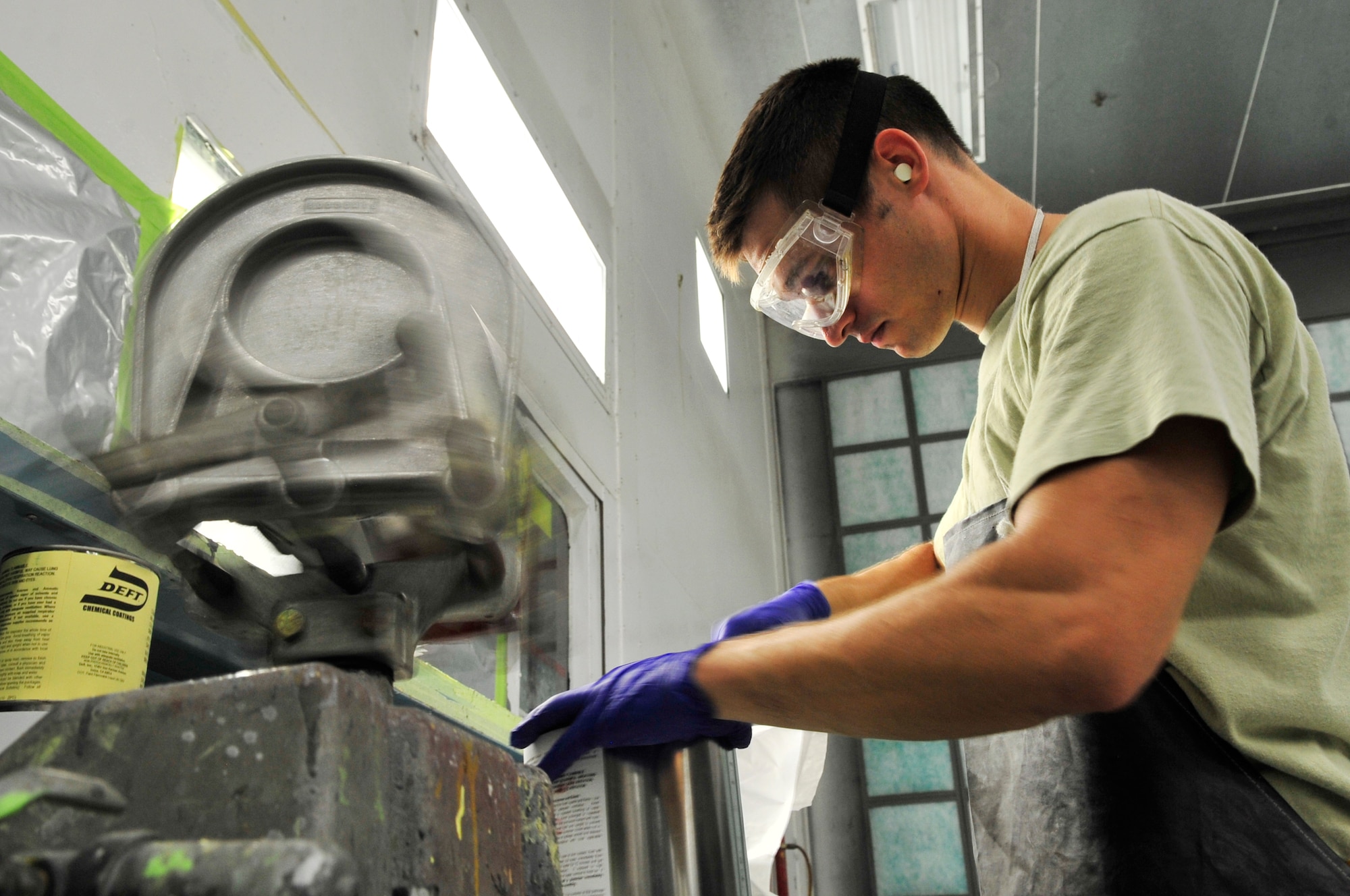 U.S. Air Force Staff Sgt. Alex Gamm, 20th Equipment Maintenance Squadron aircraft equipment specialist, opens a can of paint before painting an Aardvark F-111 at Shaw Air Force Base, S.C., July 27, 2012.   The  F-111 was to assigned to the 20th Fighter wing from 1970 to 1993.  It flew on 21 missions during Operation Desert Storm and will now be on display as a static aircraft here at Shaw.(U.S. Air Force photo by Airman Nicole Sikorski/Released) 
