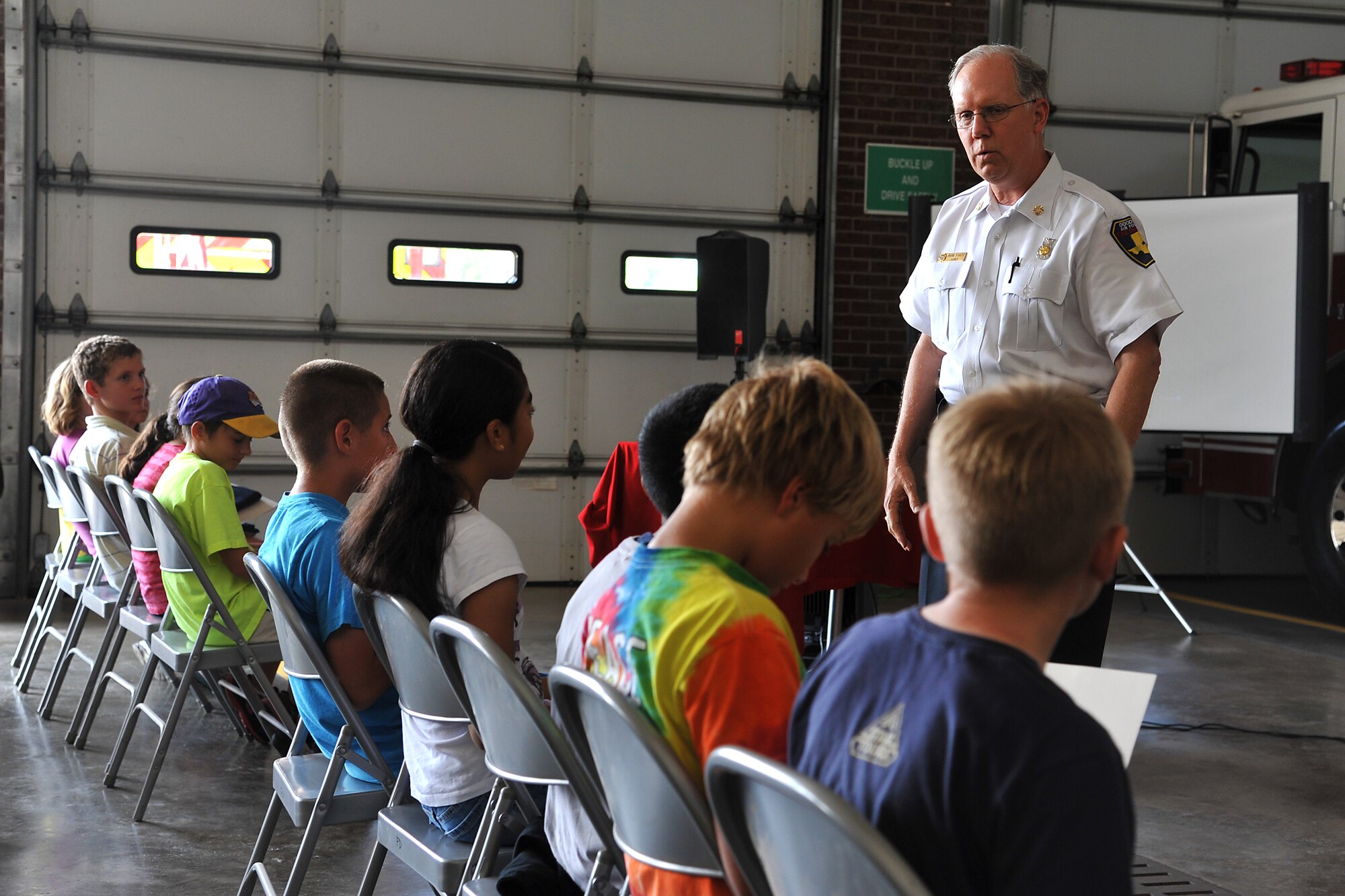 GOODFELLOW AIR FORCE BASE, Texas--John Foote, 17th Civil Engineer Squadron fire chief, gives words of wisdom to camp members during their graduation July 23. The camp gives children the opportunity to learn life saving skills for medical and fire emergencies. (U.S. Air Force photo/Airman 1st Class Michael Smith)