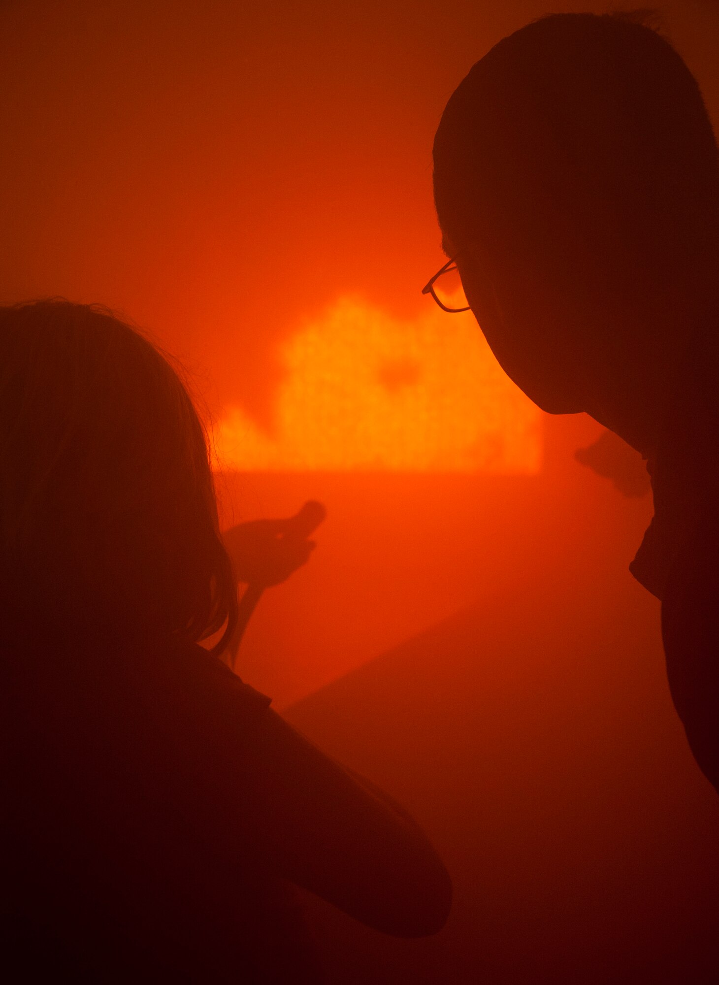 GOODFELLOW AIR FORCE BASE, Texas--Jason Garcia, 17th Civil Engineer Squadron fire inspector, teaches a Junior Firefighter Camp member how to extinguish a simulated fire July 23. The camp gives children the opportunity to learn life saving skills for medical and fire emergencies. (U.S. Air Force photo/Airman 1st Class Michael Smith)