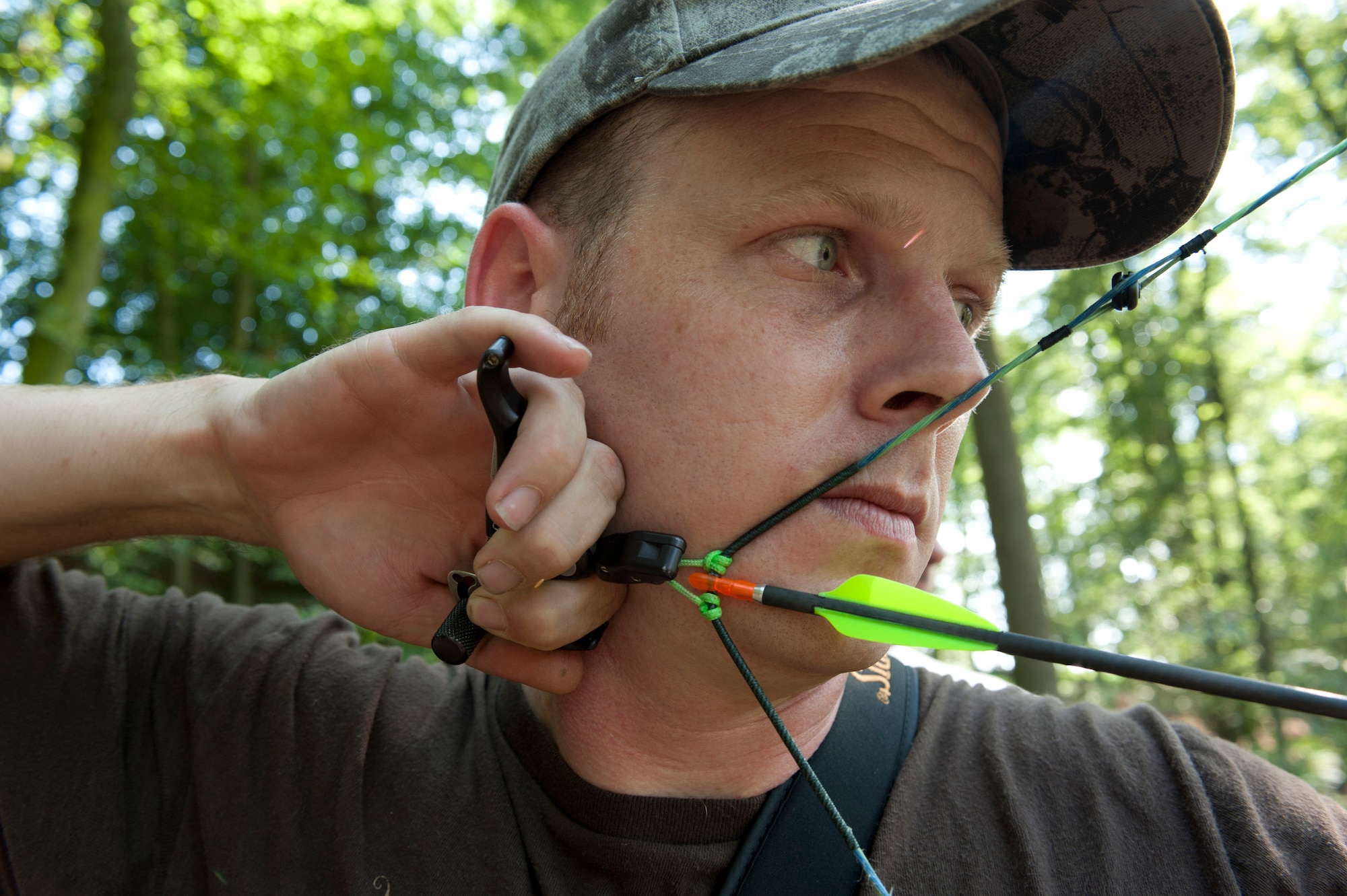 DAHLEM, Germany -- Tech. Sgt. Kevin Phillips, 52nd Equipment Maintenance Squadron aircraft structural maintainer, pulls back his bow to shoot an arrow at 3-D targets at the Eifel Bow Hunting Club here. Phillips is an amateur archer who is competing to become a professional at the European 5 Nations Field Series tournament in Ash, Luxembourg, this year. He trains with local archers with whom he builds partnerships through exchanging archery techniques. (U.S.  Air Force photo by Senior Airman Natasha Stannard/Released)
