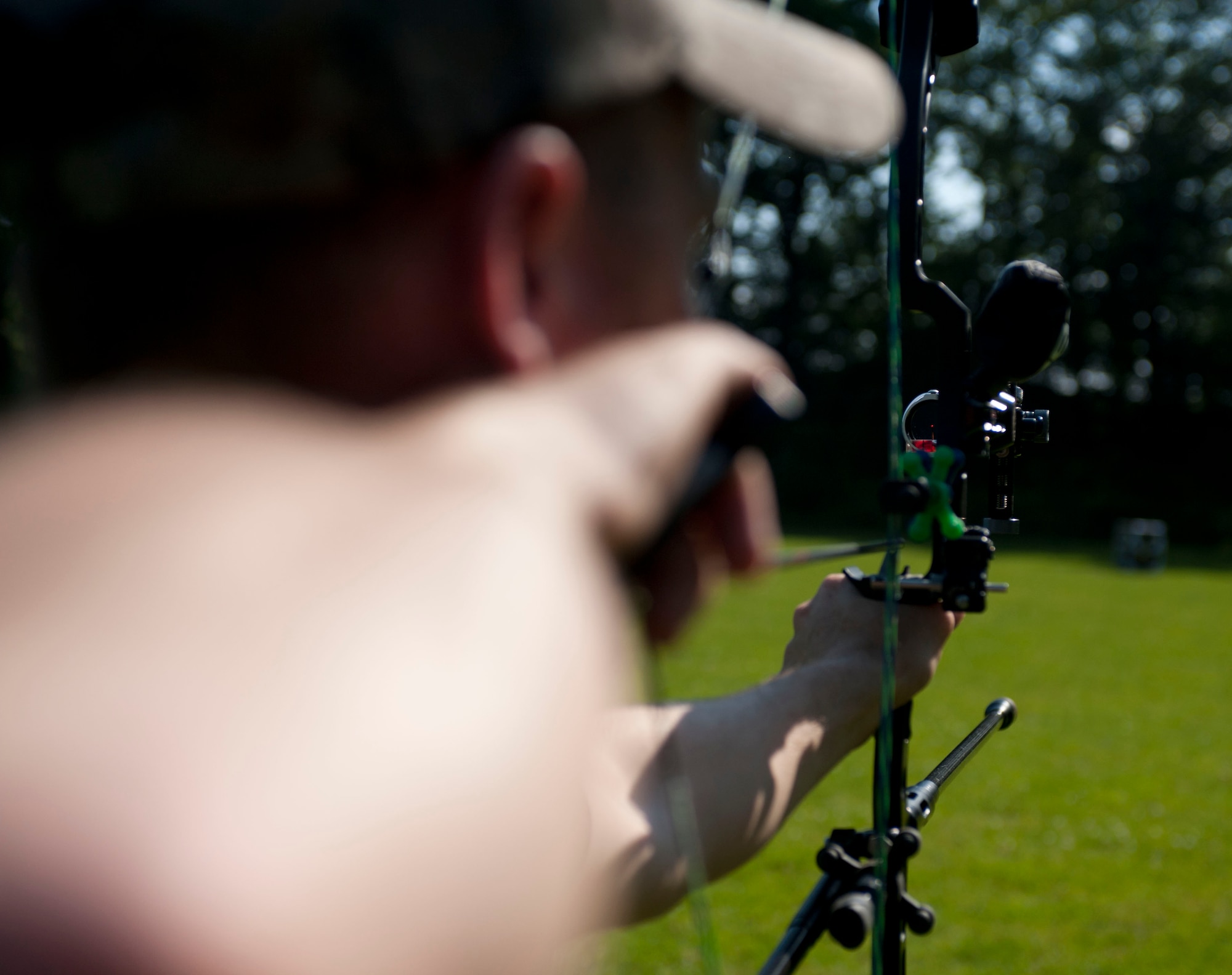 DADAHLEM, Germany -- Tech. Sgt. Kevin Phillips, 52nd Equipment Maintenance Squadron aircraft structural maintainer, uses his sight to find the center of a target before releasing his arrow at the Eifel Bow Hunting Club July 26 here. Phillips is an amateur archer who is competing to become a professional at the European 5 Nations Field Series tournament in Ash, Luxembourg, this year. He trains with local archers with whom he builds partnerships through exchanging archery techniques. (U.S.  Air Force photo by Senior Airman Natasha Stannard/Released)