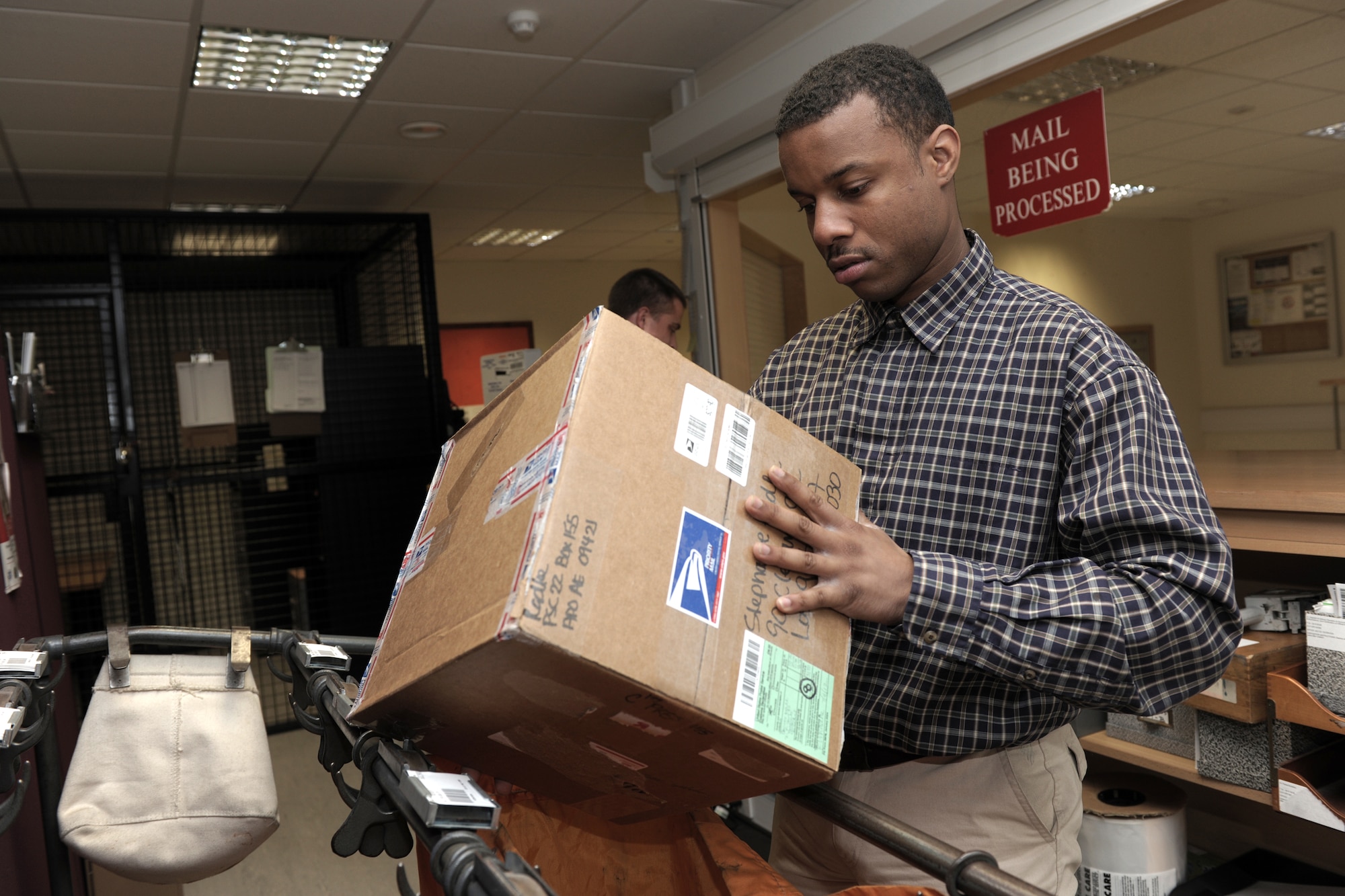 LONDON – Staff Sgt. Stacey Bailey, 422nd Communications Squadron Blenheim Crescent Post Office in London, prepares mail for distribution to customers July 11. The Blenheim Crescent Post Office in London serves American Personnel stationed in London. (U.S. Air Force photo by Master Sgt. John Barton)