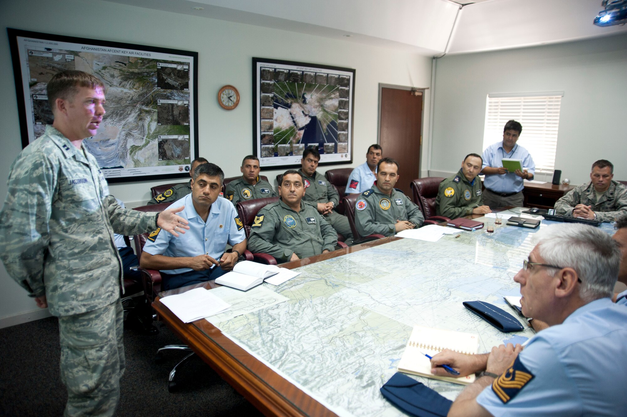 Capt. Christopher Jacobson, 728th Air Mobility Squadron, briefs members of the Turkish air force during a site visit July 25, 2012, at Incirlik Air Base, Turkey. The 728th AMS hosted the visit to help members of the Turkish air force 11th Tanker Command enhance their aerial port operations. (U.S. Air Force photo by Senior Airman Clayton Lenhardt/Released)
