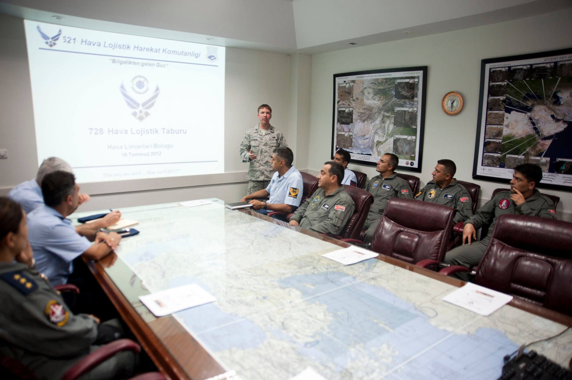 Capt. Christopher Jacobson, 728th Air Mobility Squadron, briefs members of the Turkish air force during a site visit July 25, 2012, at Incirlik Air Base, Turkey. The 728th AMS hosted the visit to help members of the Turkish air force 11th Tanker Command enhance their aerial port operations. (U.S. Air Force photo by Senior Airman Clayton Lenhardt/Released)
